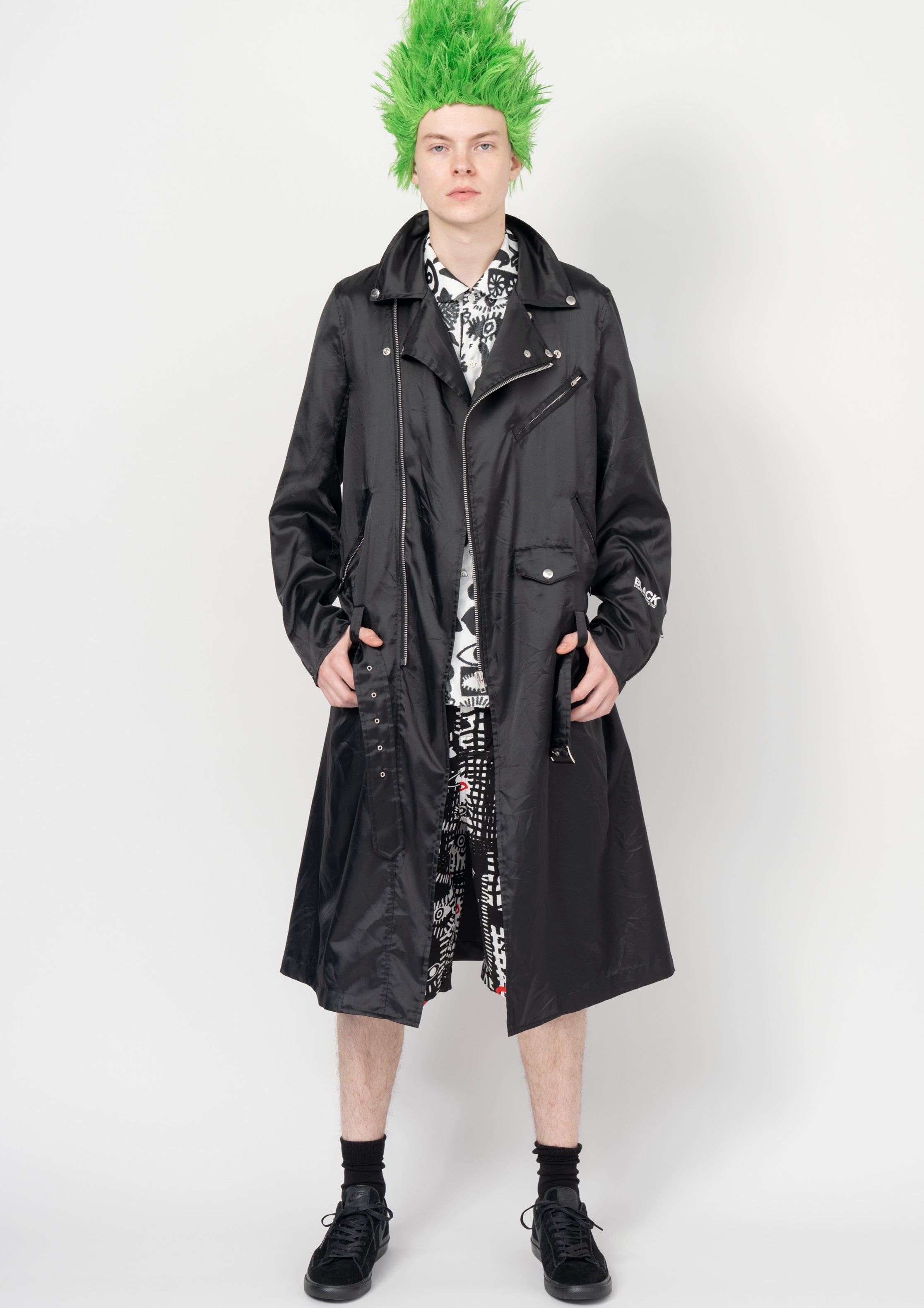 Fashion model wearing a Black Comme des Garçons SS26 outfit