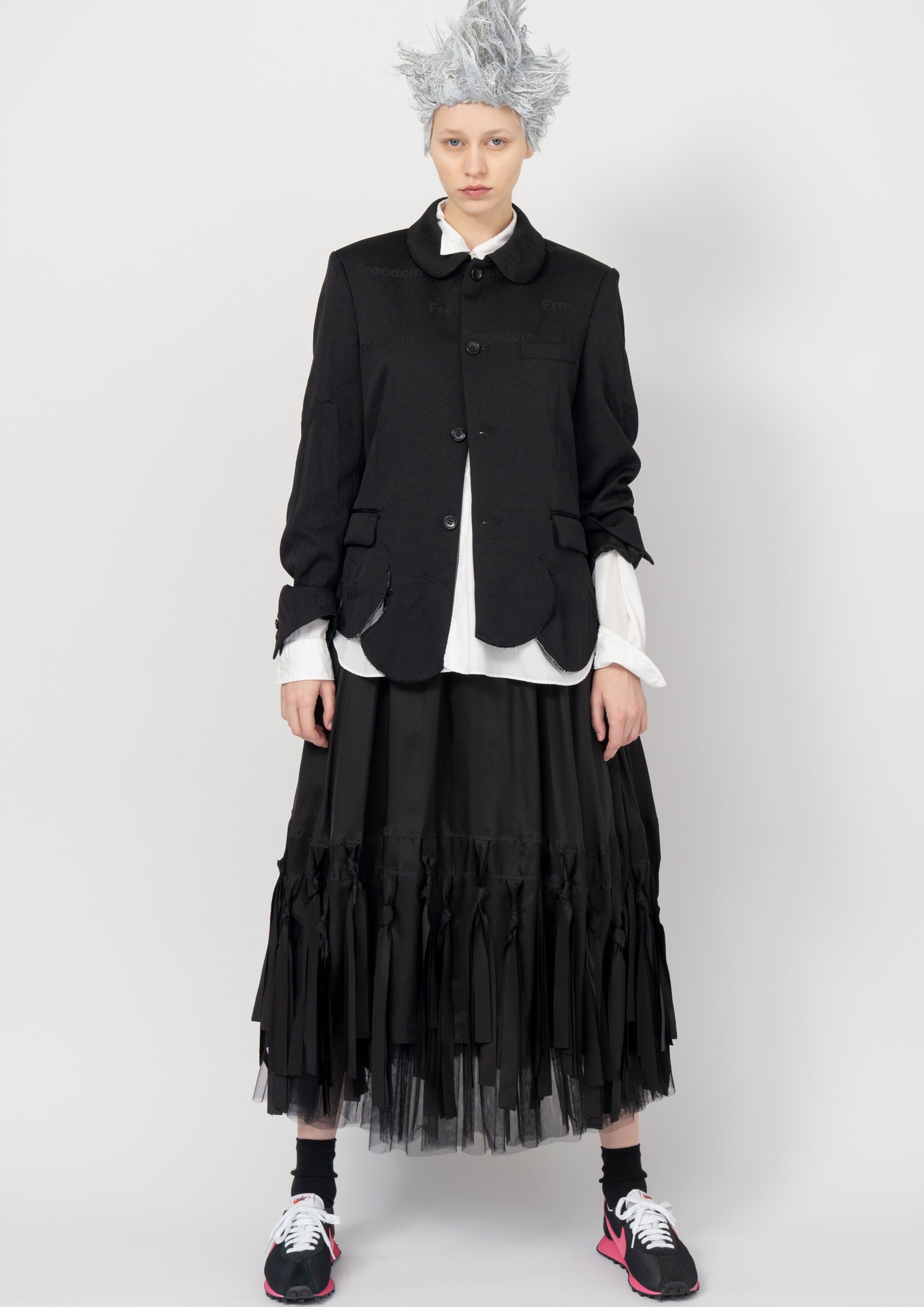 Fashion model wearing a Black Comme des Garçons SS26 outfit