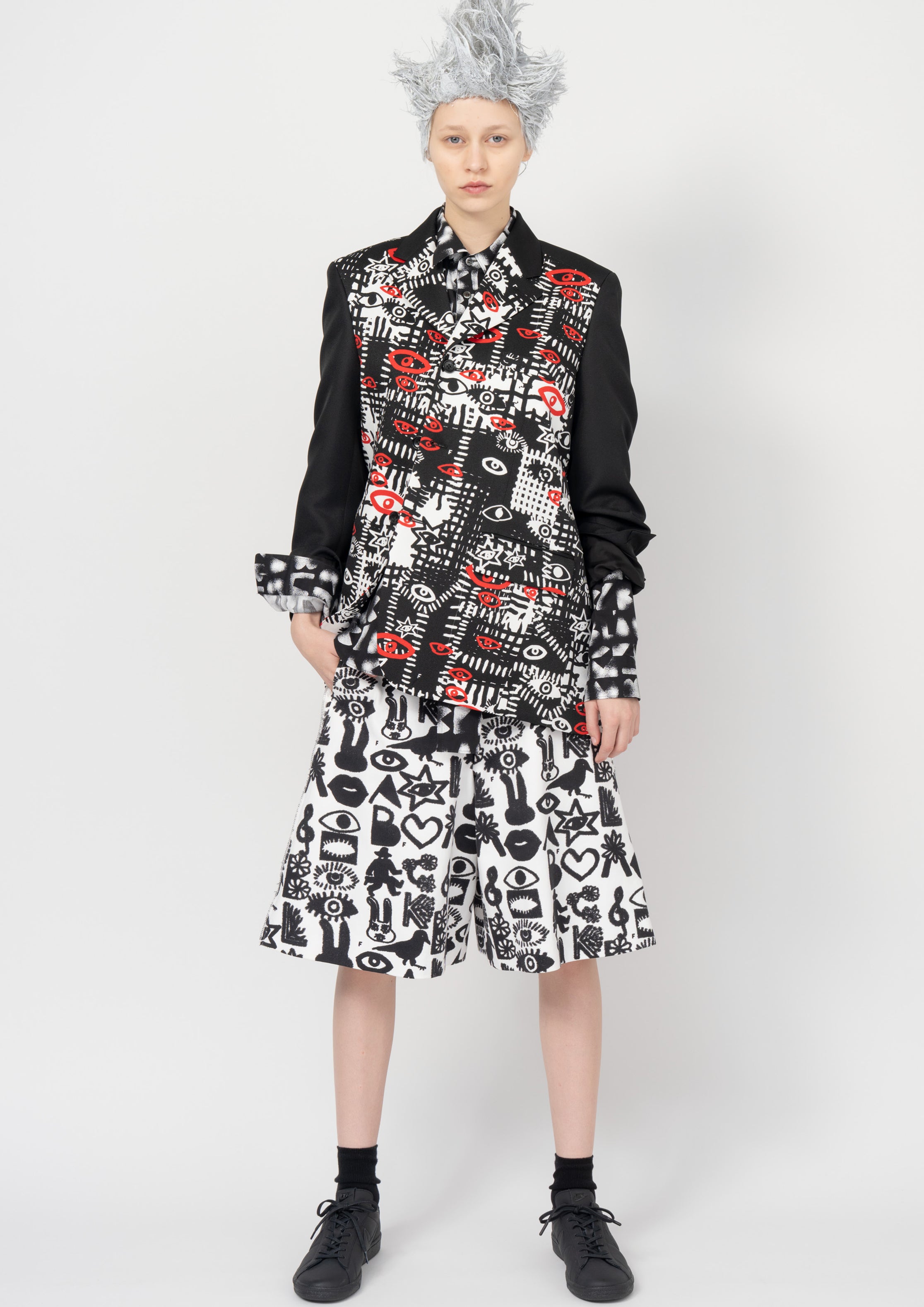 Fashion model wearing a Black Comme des Garçons SS26 outfit