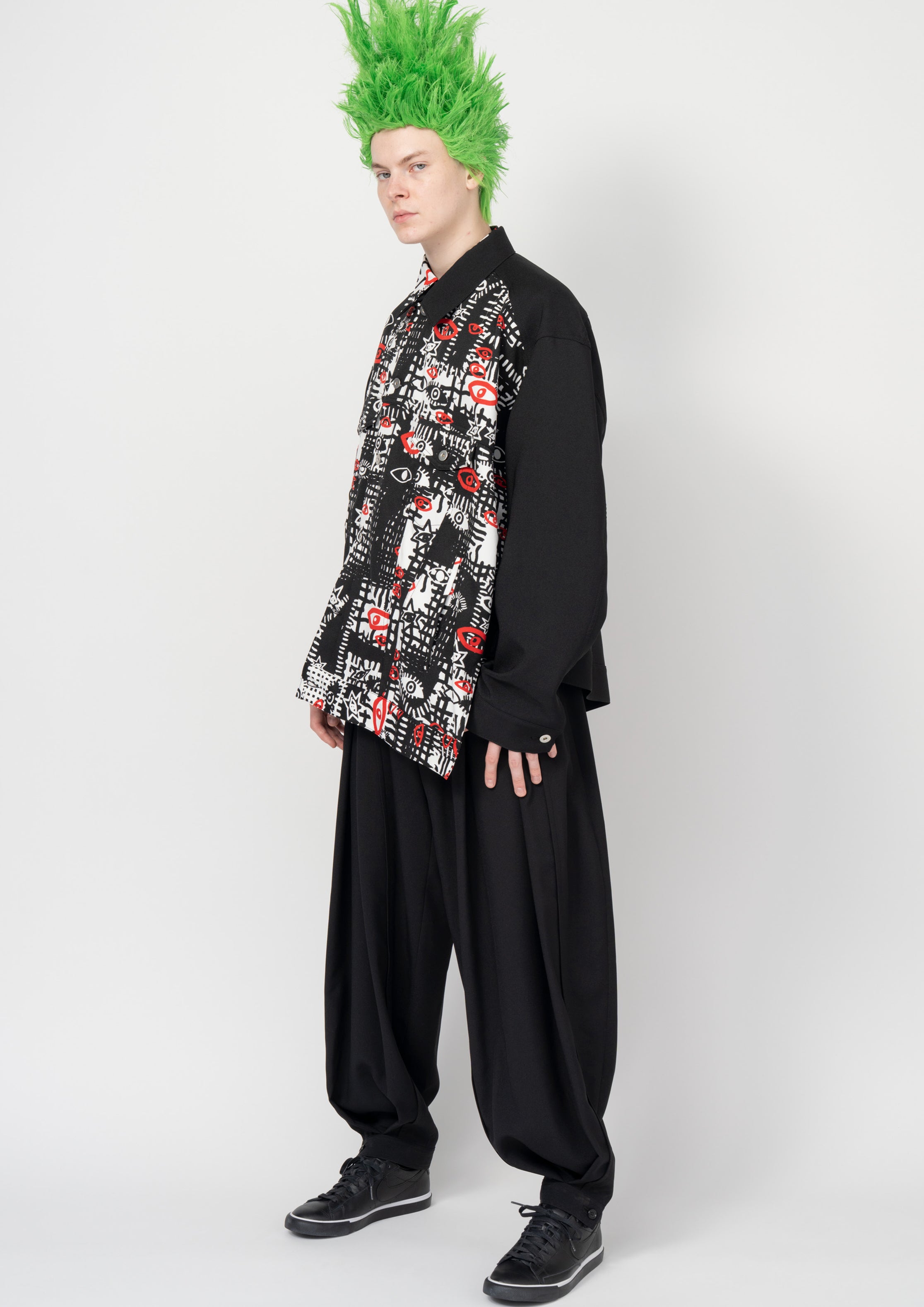 Fashion model wearing a Black Comme des Garçons SS26 outfit