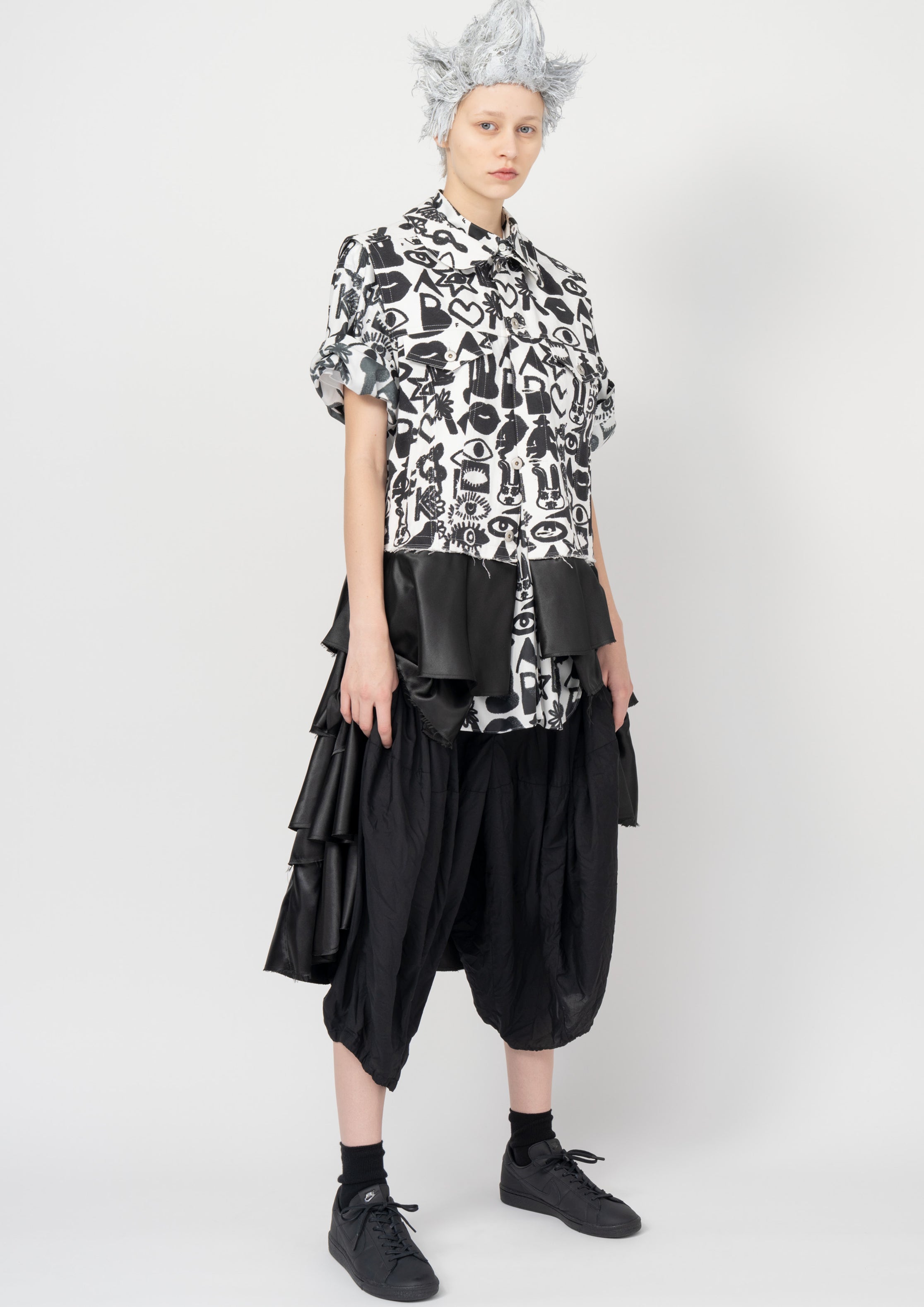 Fashion model wearing a Black Comme des Garçons SS26 outfit