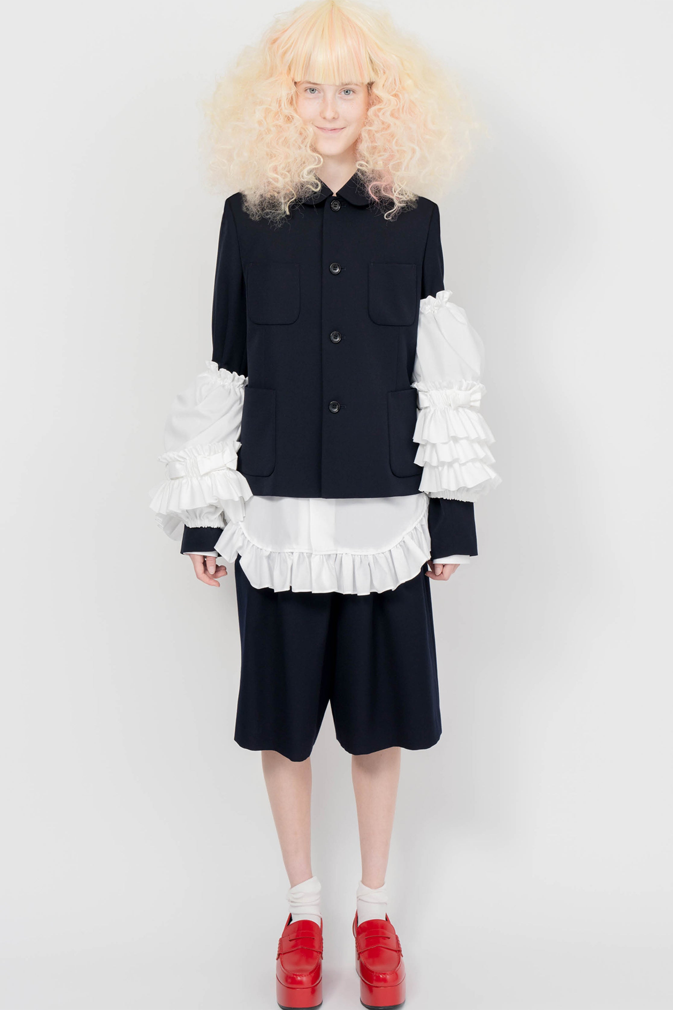 Fashion model wearing a COMME DES GARÇONS GIRL SS25 outfit