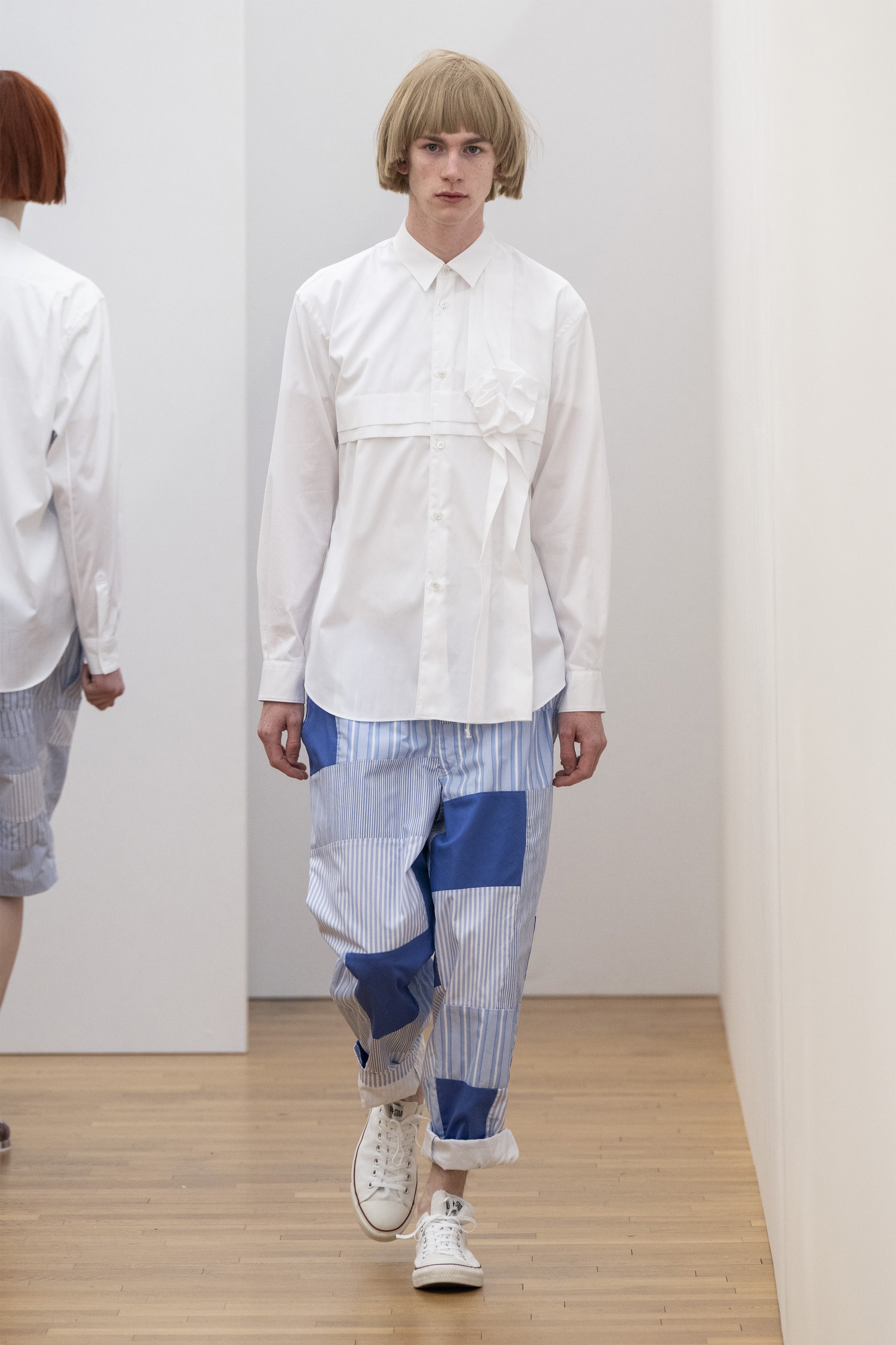 Fashion model wearing a COMME DES GARÇONS SHIRT SS25 outfit