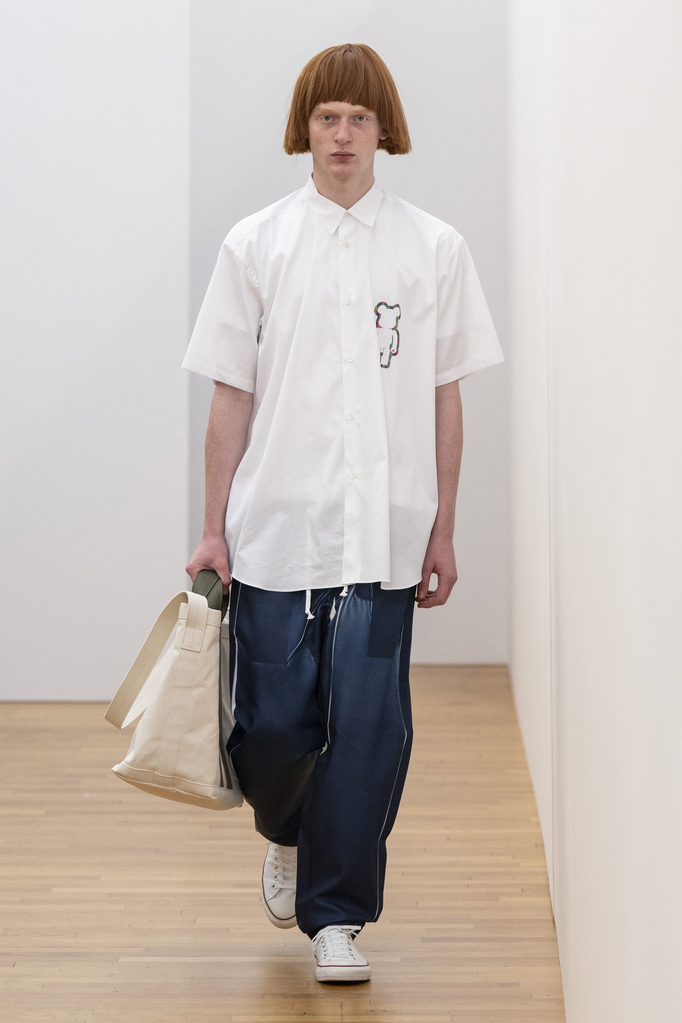 Fashion model wearing a COMME DES GARÇONS SHIRT SS25 outfit