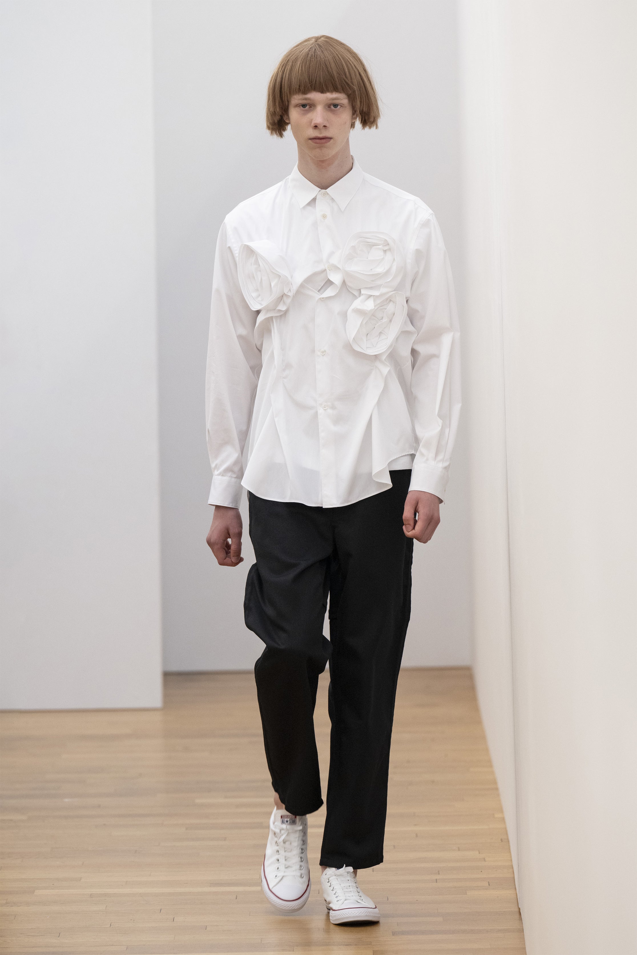 Fashion model wearing a COMME DES GARÇONS SHIRT SS25 outfit