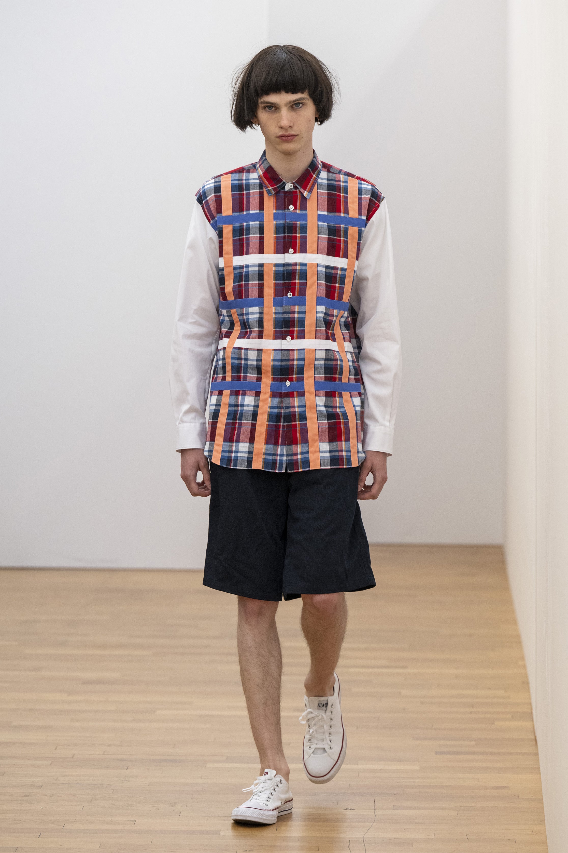 Fashion model wearing a COMME DES GARÇONS SHIRT SS25 outfit