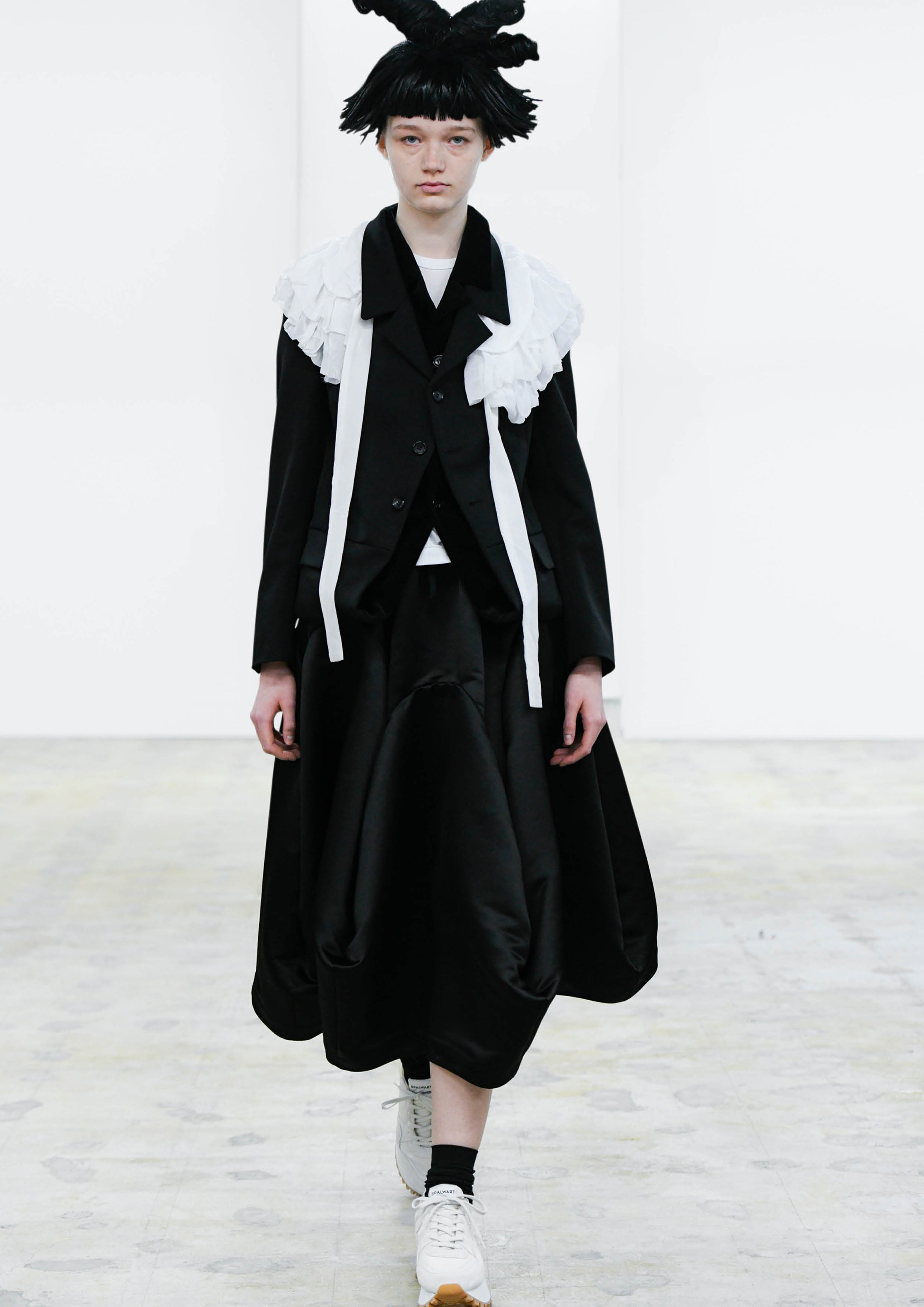 Fashion model wearing a COMME DES GARÇONS COMME DES GARÇONS AW24 outfit