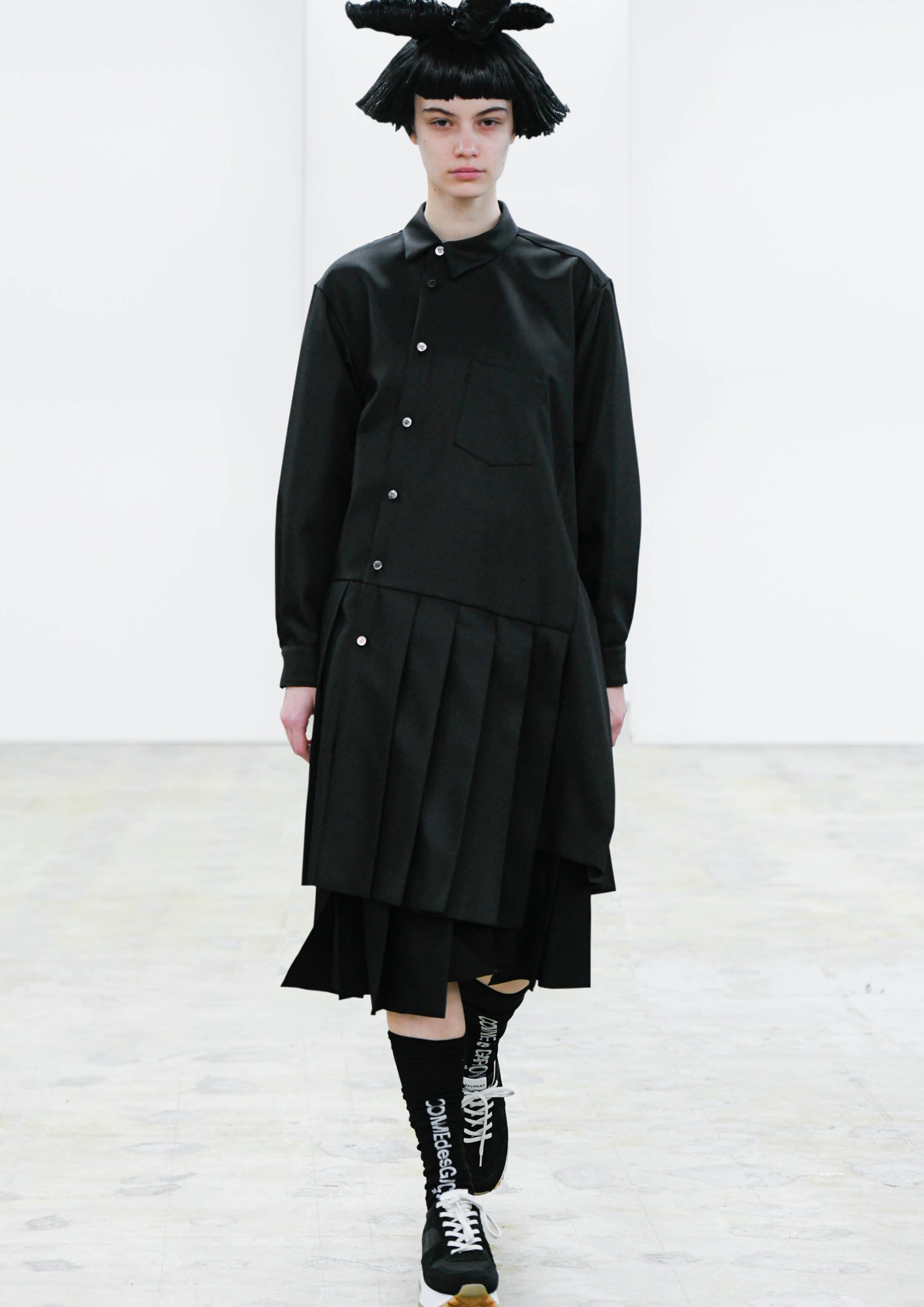 Fashion model wearing a COMME DES GARÇONS COMME DES GARÇONS AW24 outfit