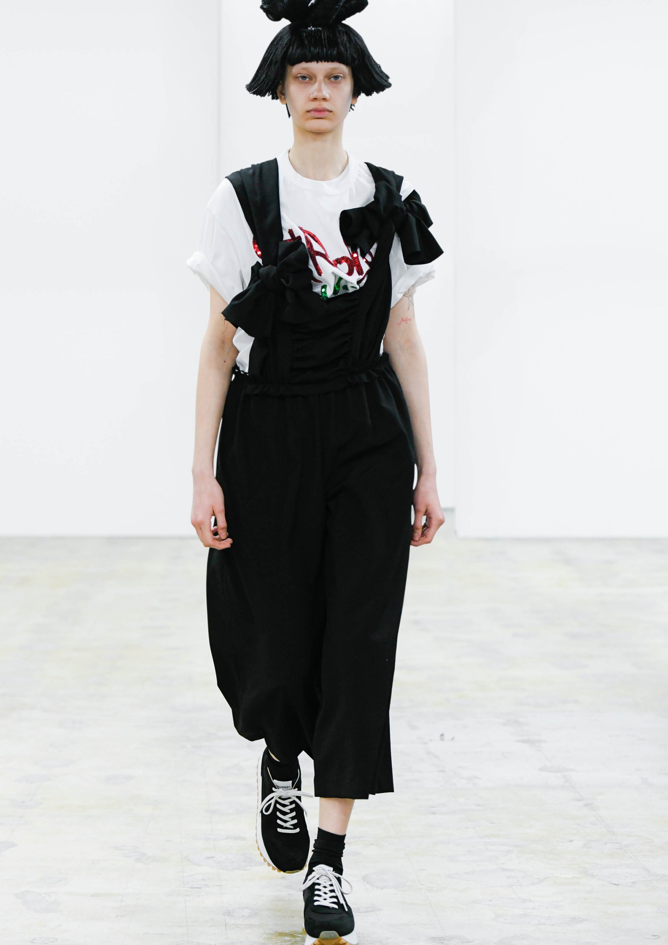 Fashion model wearing a COMME DES GARÇONS COMME DES GARÇONS AW24 outfit