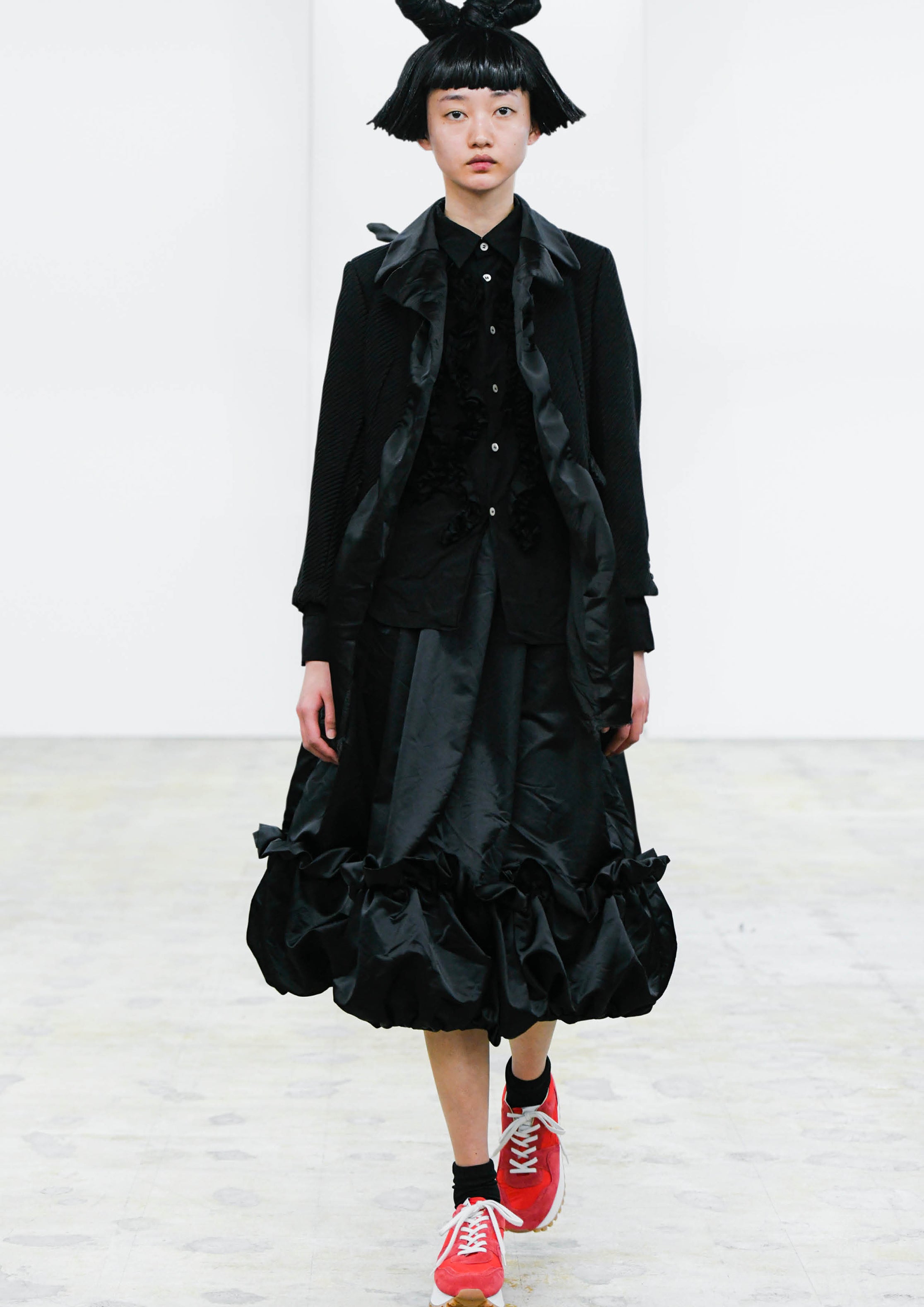 Fashion model wearing a COMME DES GARÇONS COMME DES GARÇONS AW24 outfit