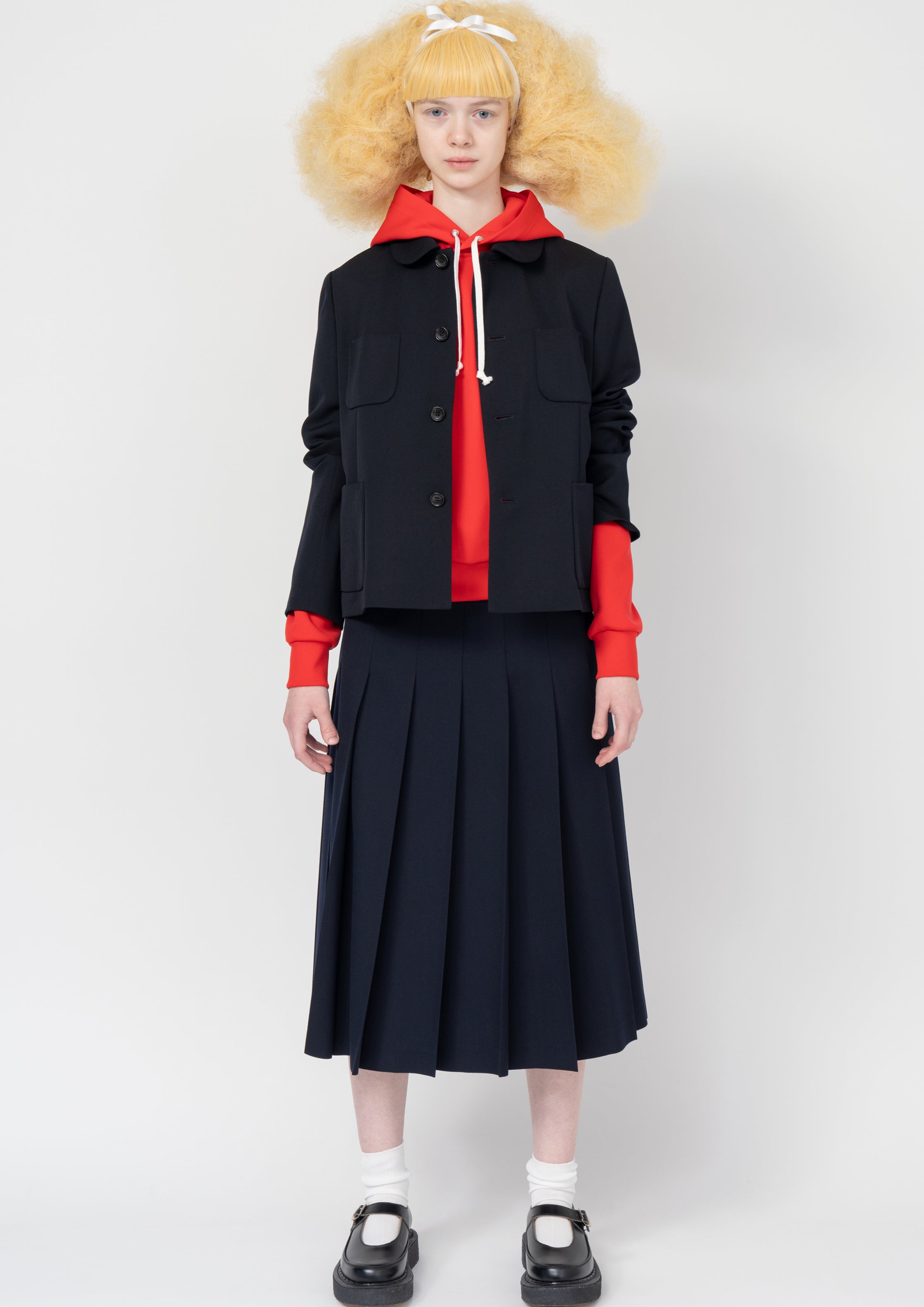 Fashion model wearing a Comme des Garçons SS26 outfit