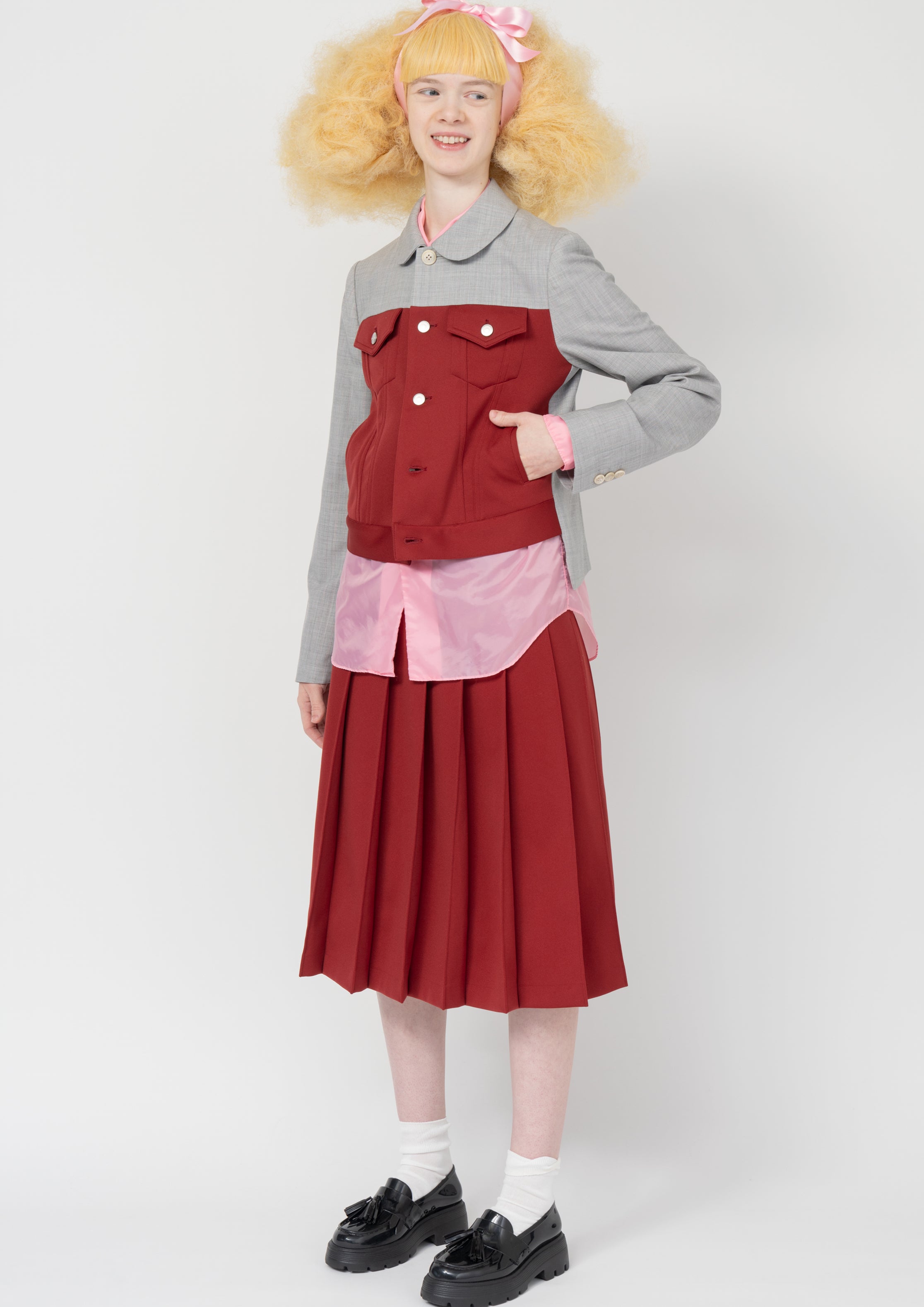 Fashion model wearing a Comme des Garçons SS26 outfit