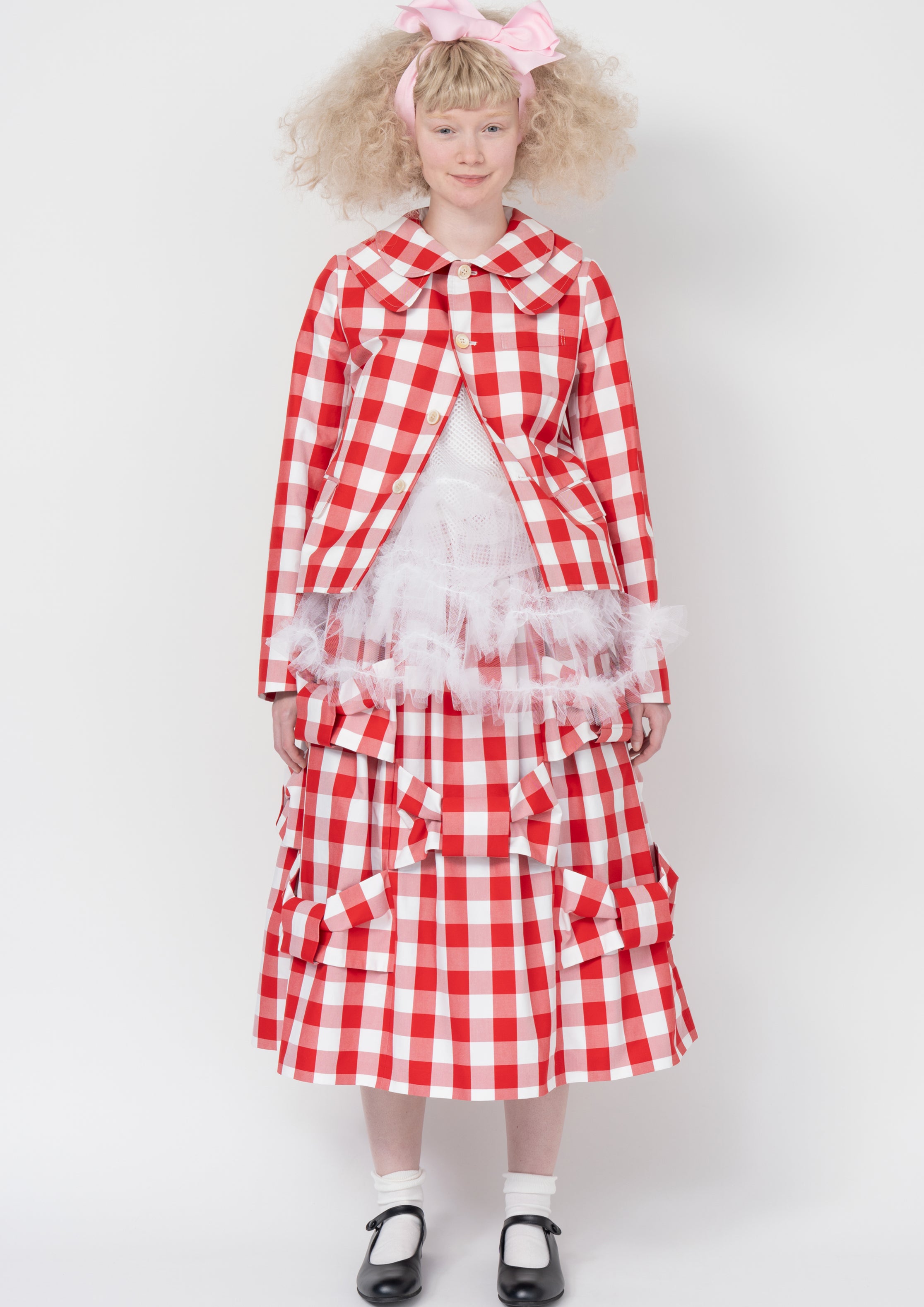 Fashion model wearing a Comme des Garçons SS26 outfit