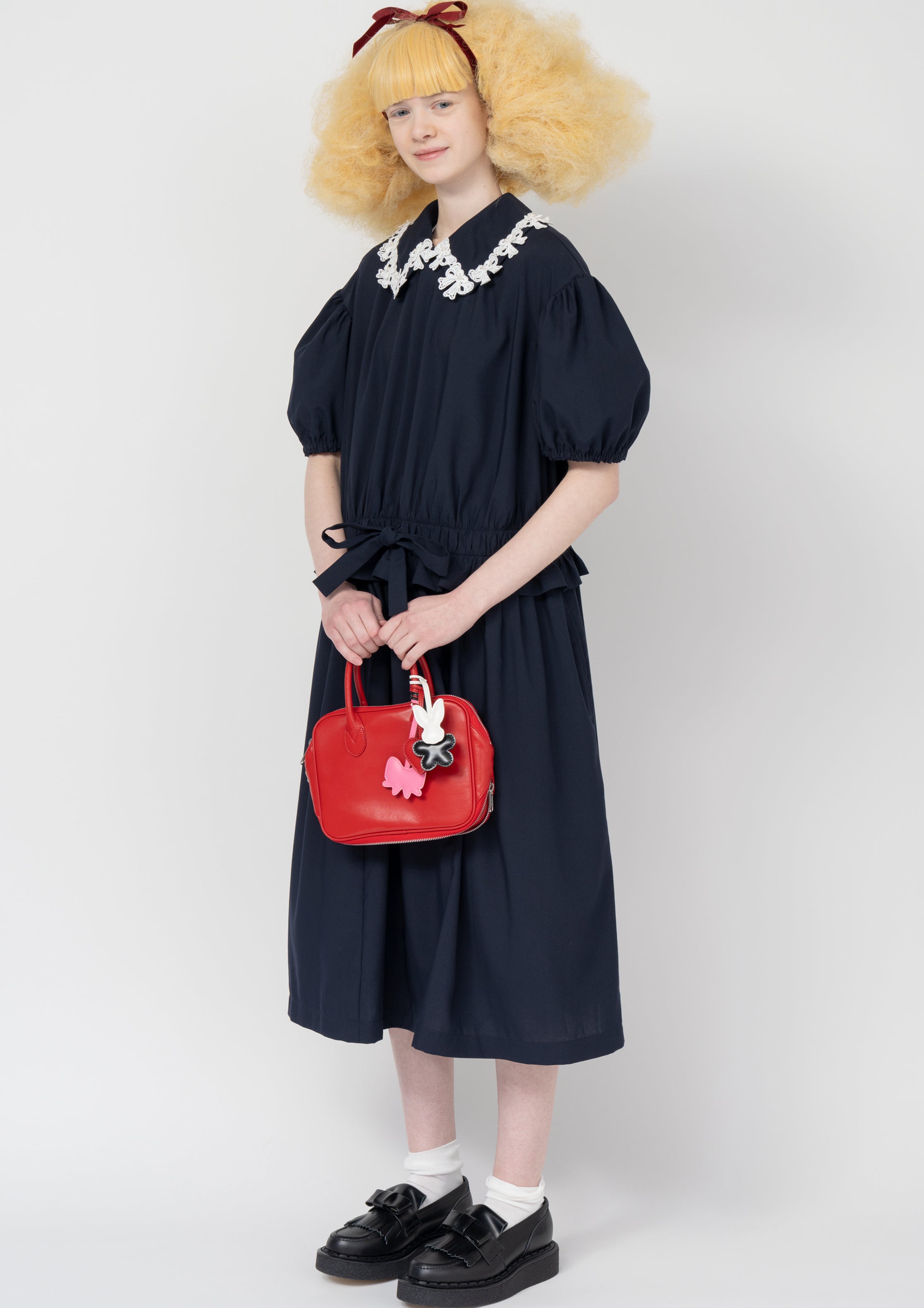 Fashion model wearing a Comme des Garçons SS26 outfit