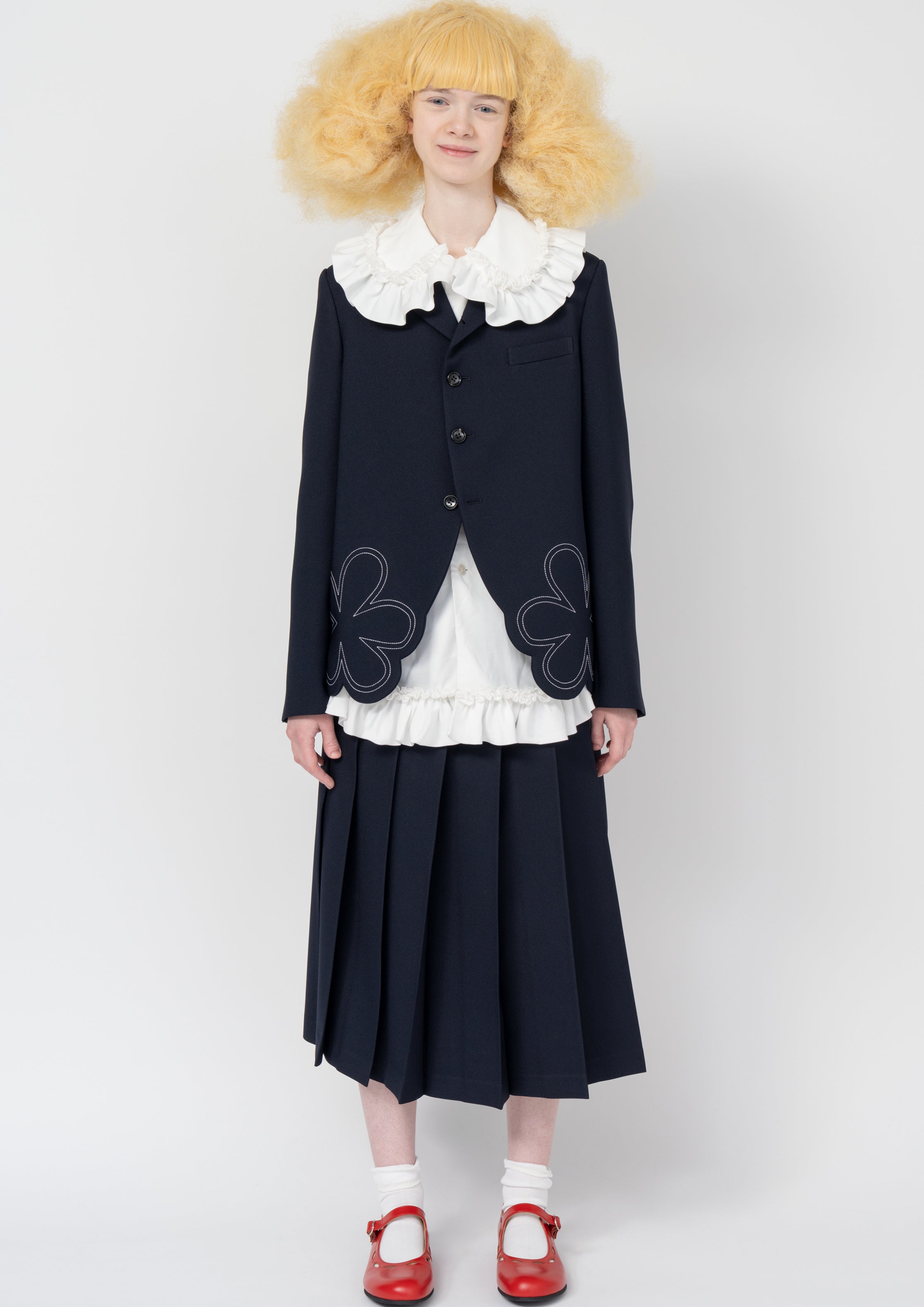 Fashion model wearing a Comme des Garçons SS26 outfit