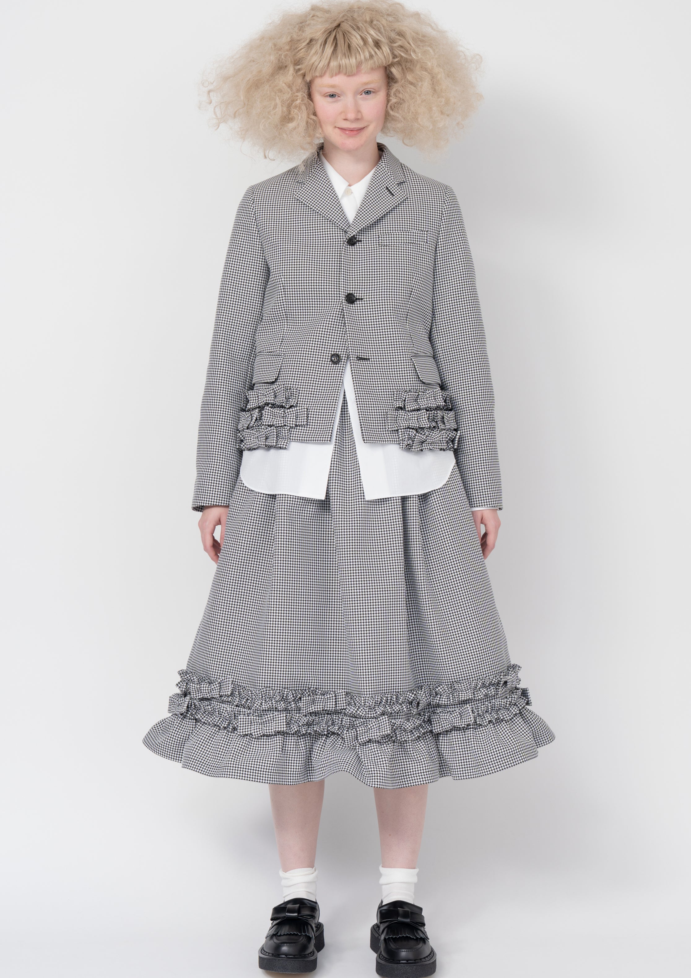 Fashion model wearing a Comme des Garçons SS26 outfit