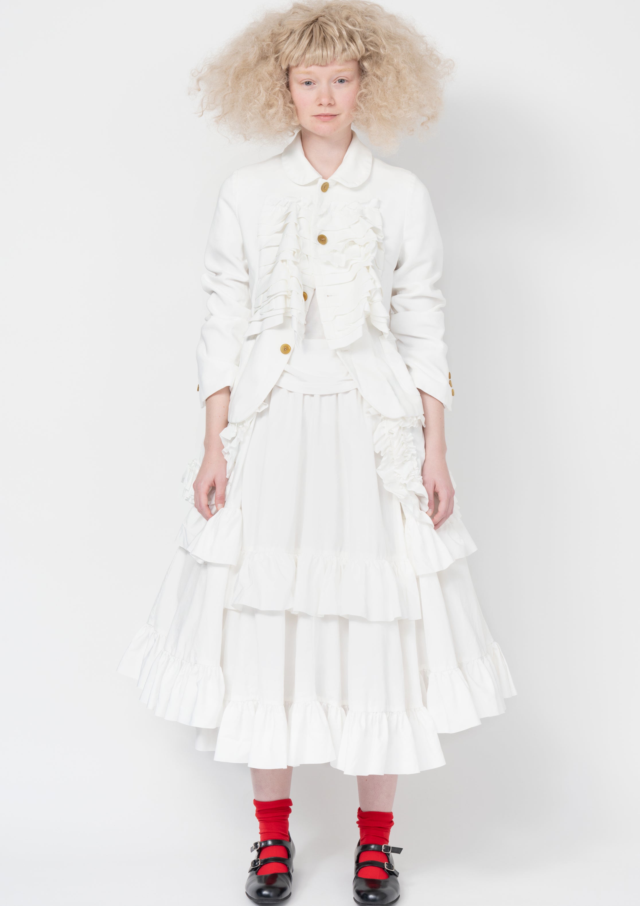 Fashion model wearing a Comme des Garçons SS26 outfit