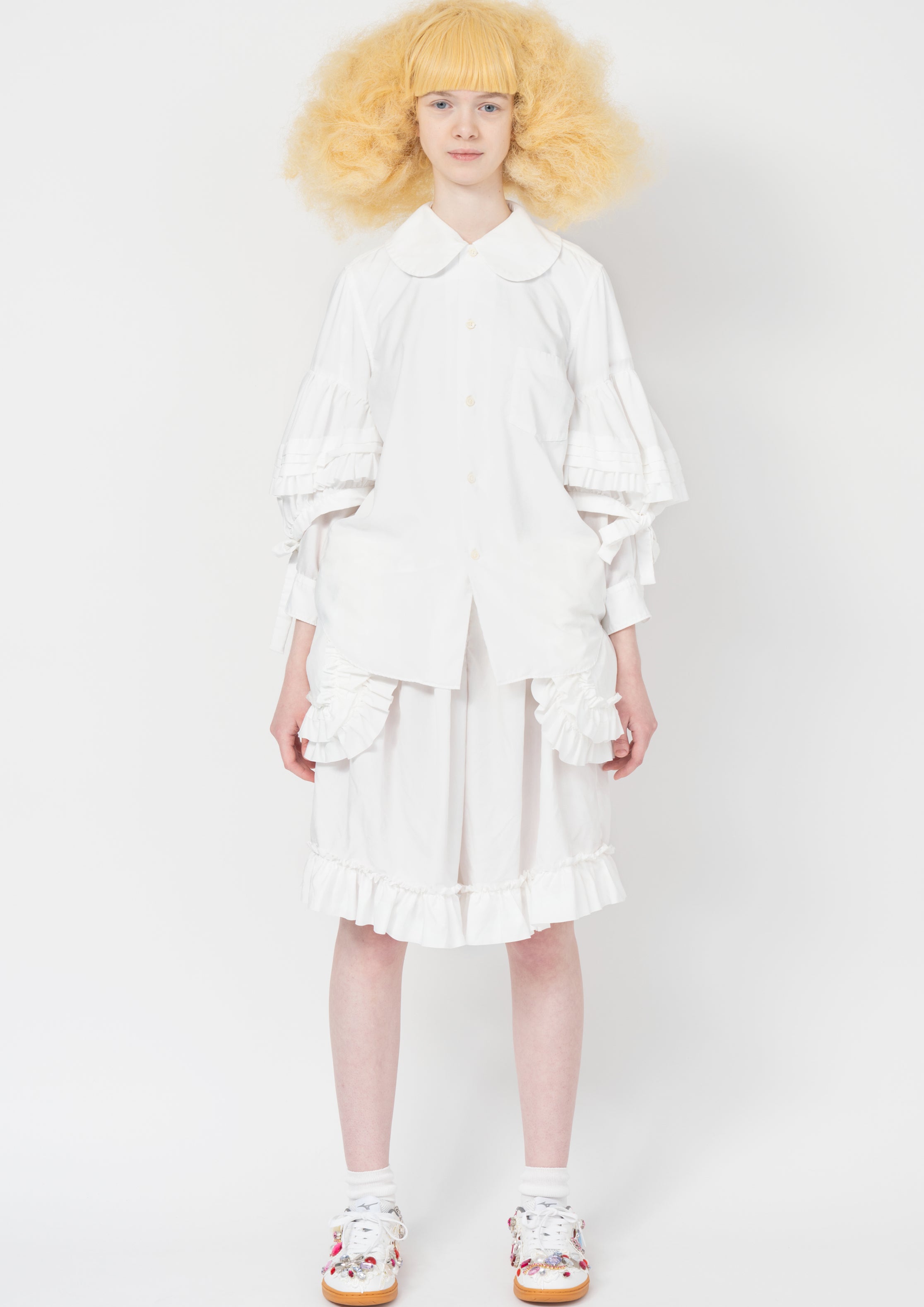 Fashion model wearing a Comme des Garçons SS26 outfit