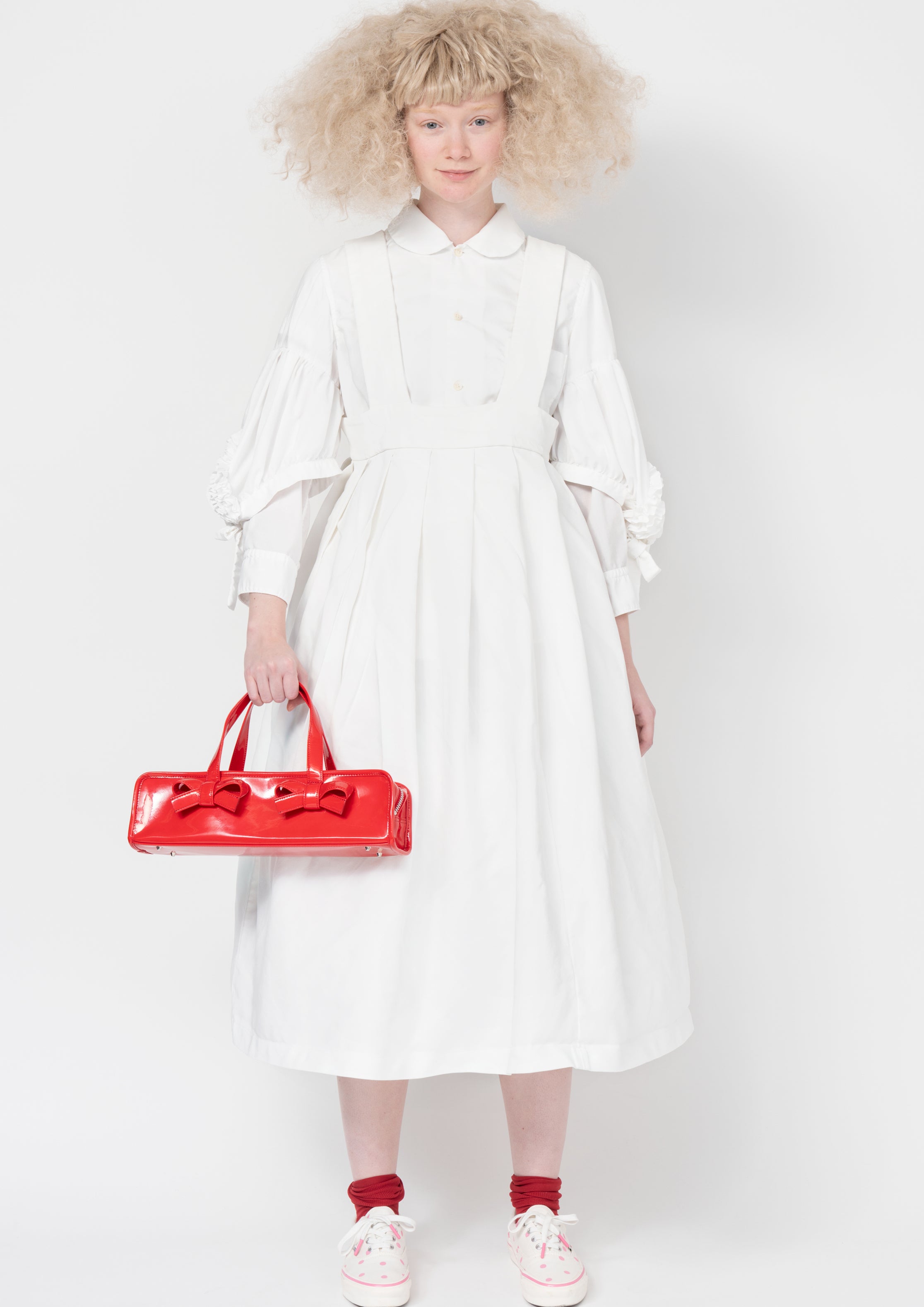 Fashion model wearing a Comme des Garçons SS26 outfit