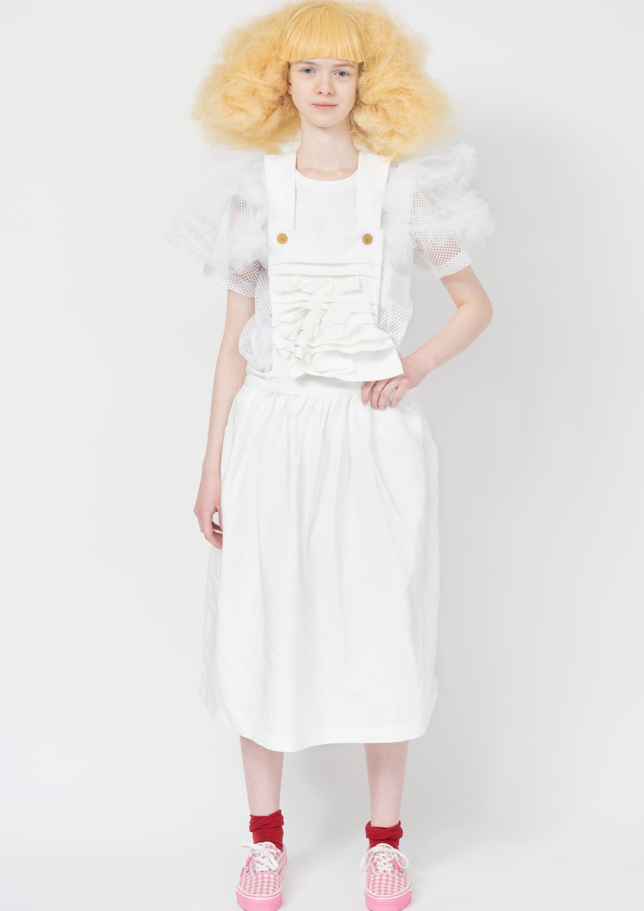 Fashion model wearing a Comme des Garçons SS26 outfit