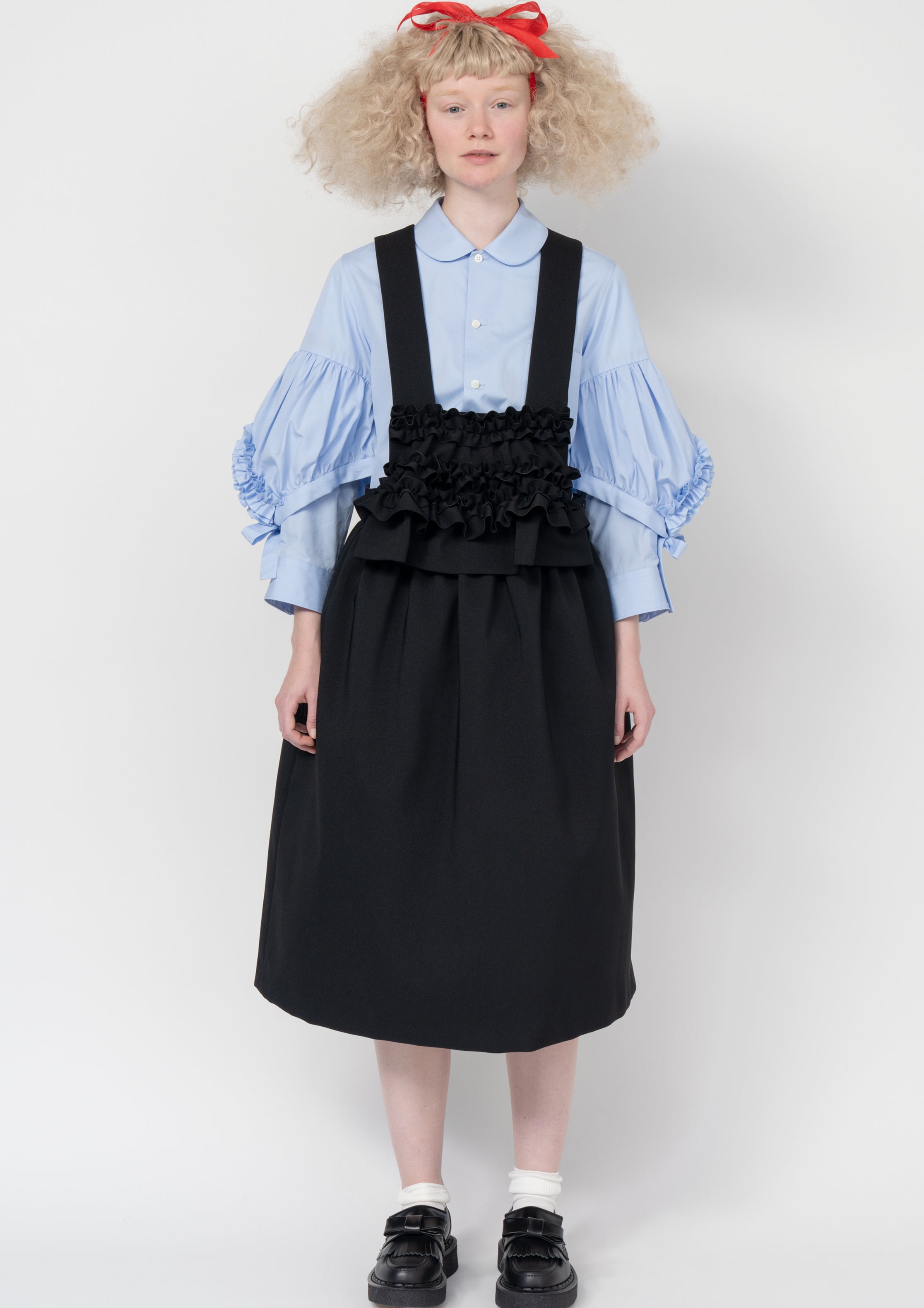 Fashion model wearing a Comme des Garçons SS26 outfit