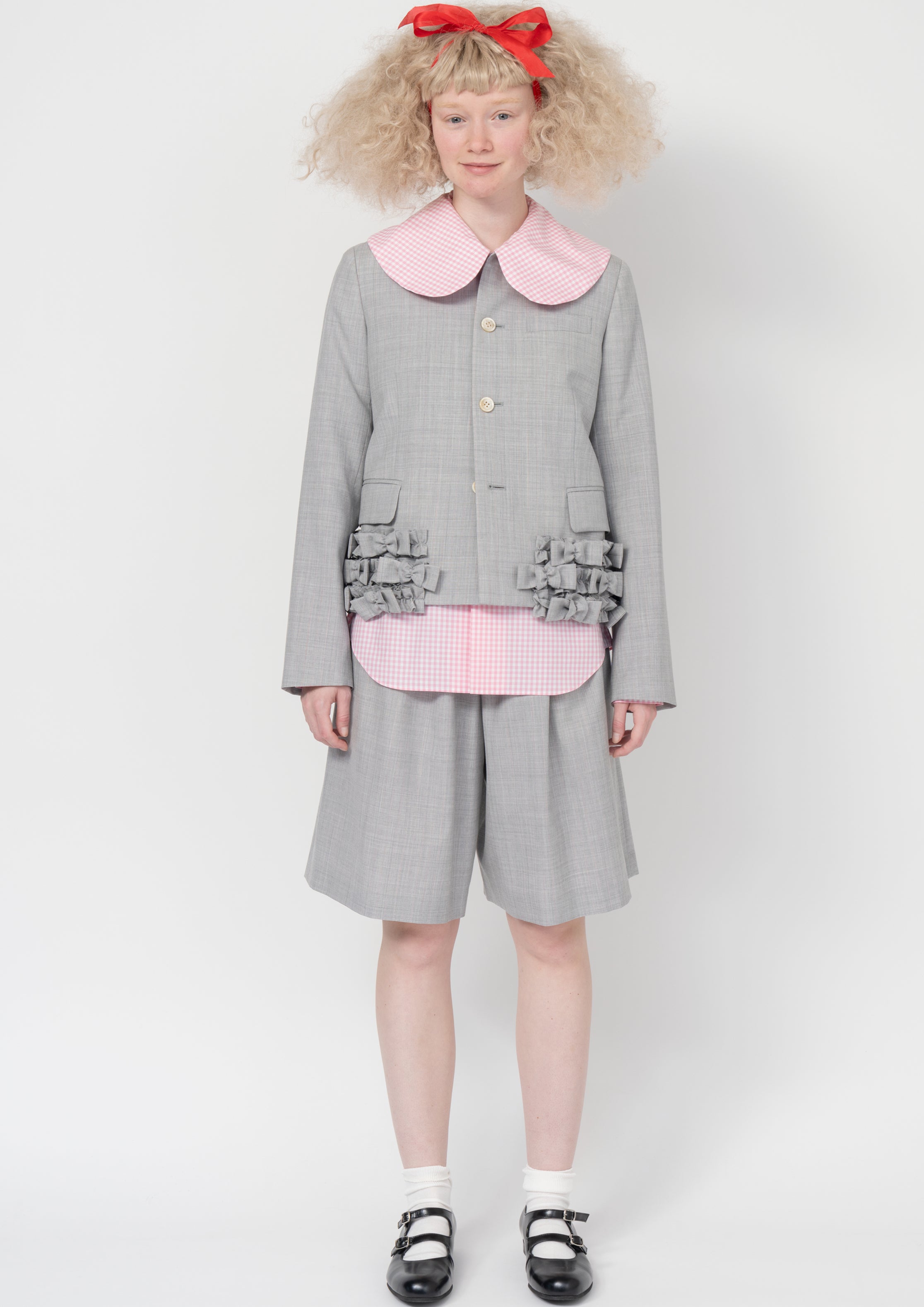 Fashion model wearing a Comme des Garçons SS26 outfit