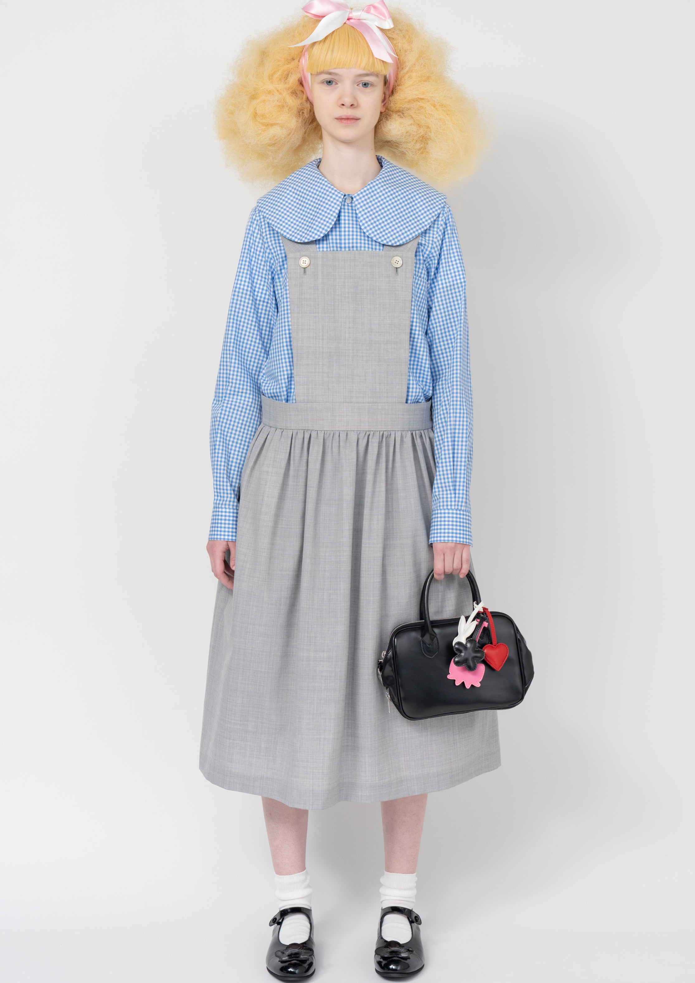 Fashion model wearing a Comme des Garçons SS26 outfit