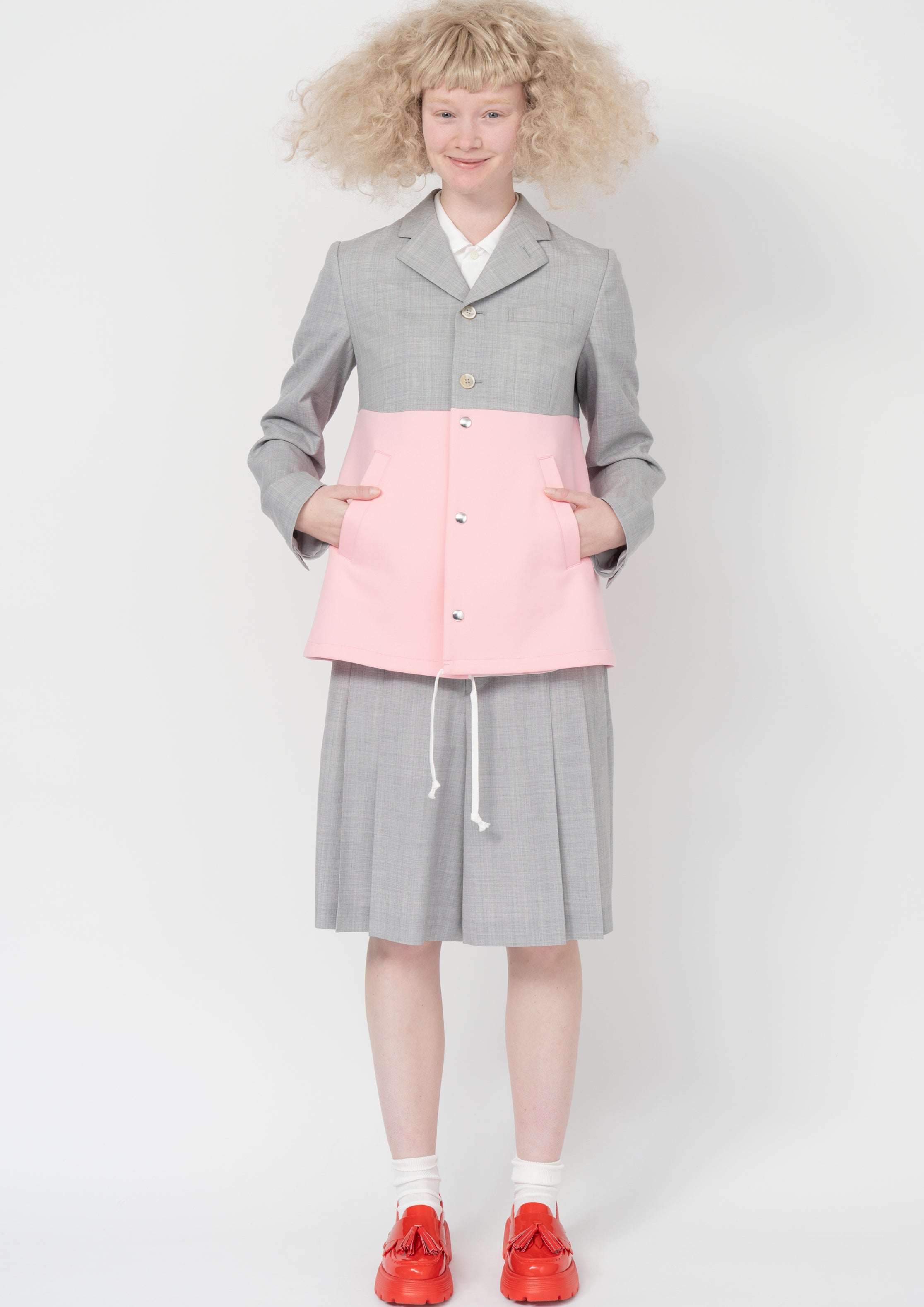 Fashion model wearing a Comme des Garçons SS26 outfit