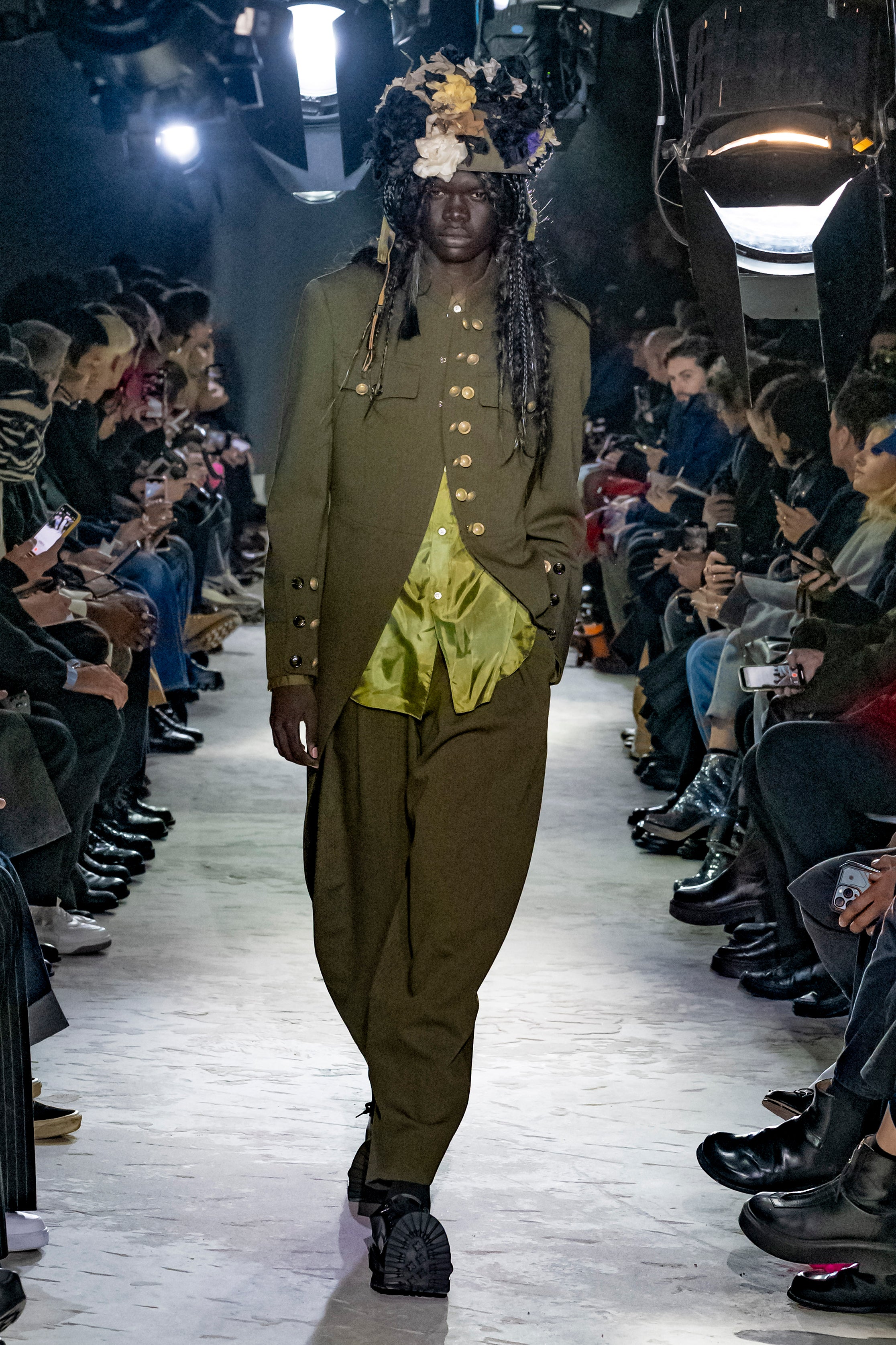Fashion model wearing a Comme des Garçons Homme Plus AW25 outfit