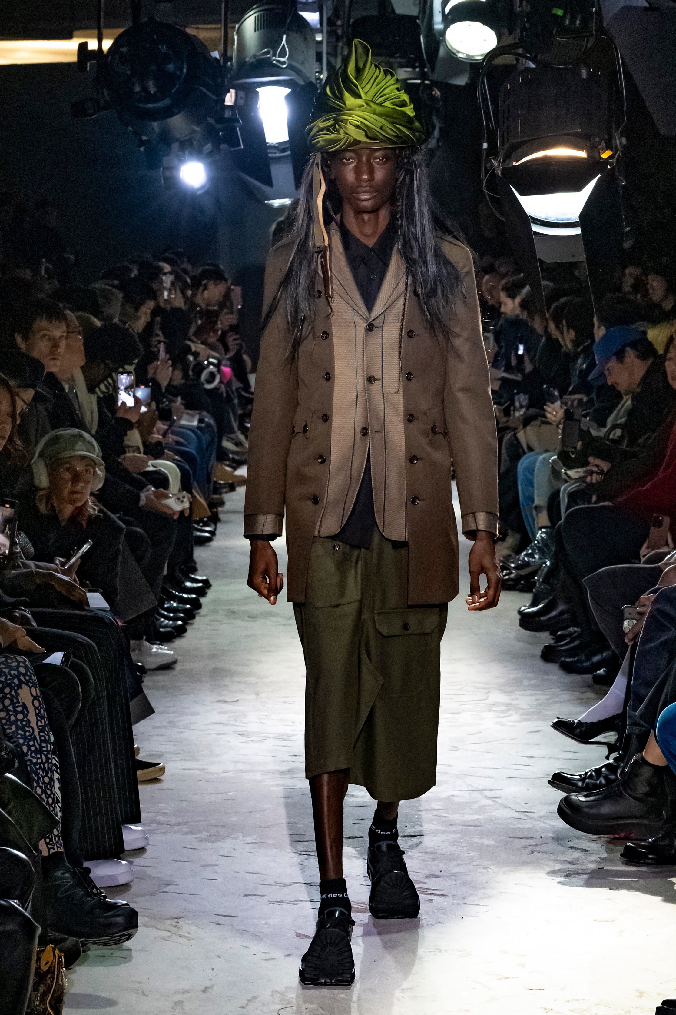 Fashion model wearing a Comme des Garçons Homme Plus AW25 outfit