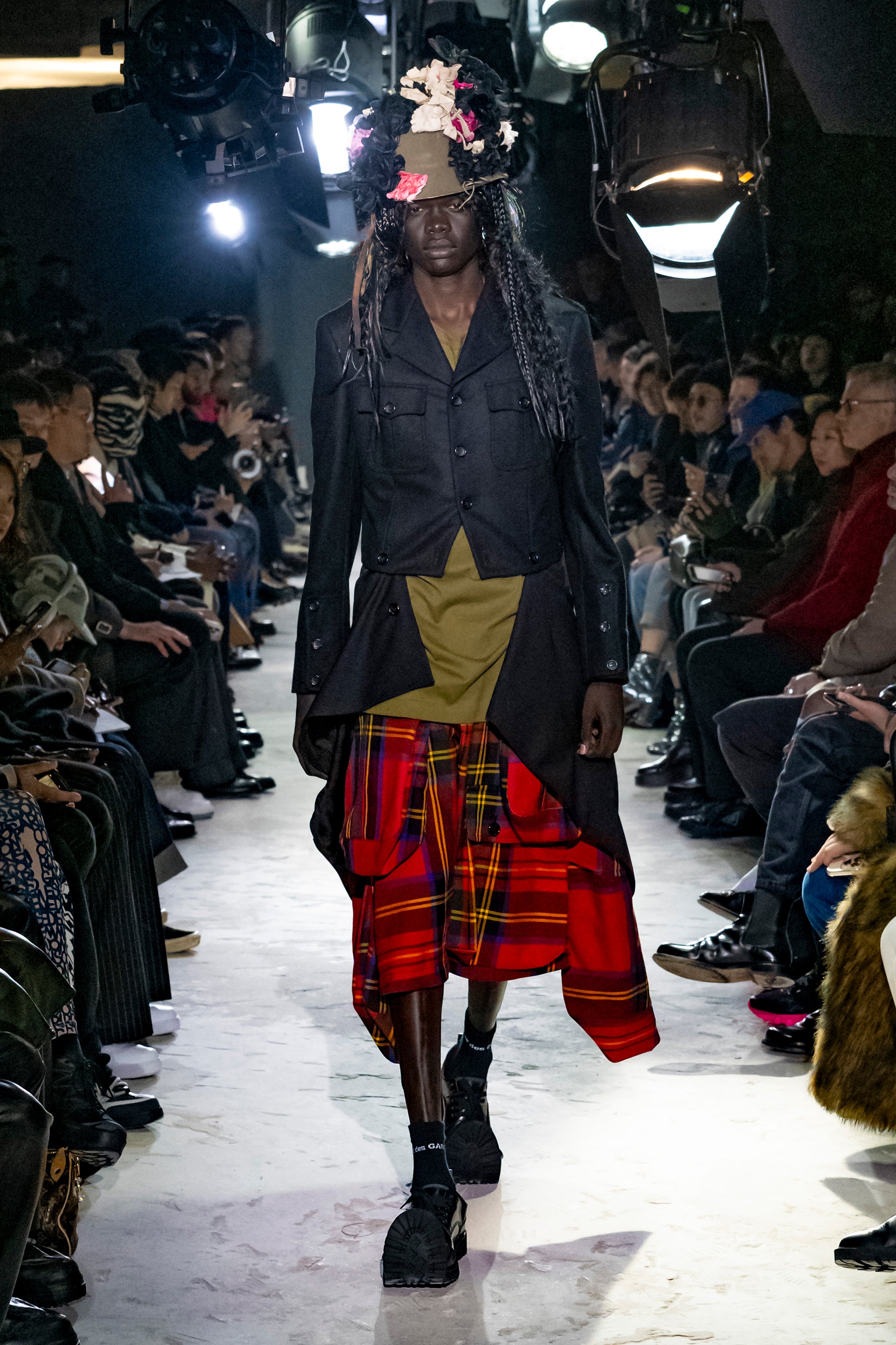 Fashion model wearing a Comme des Garçons Homme Plus AW25 outfit