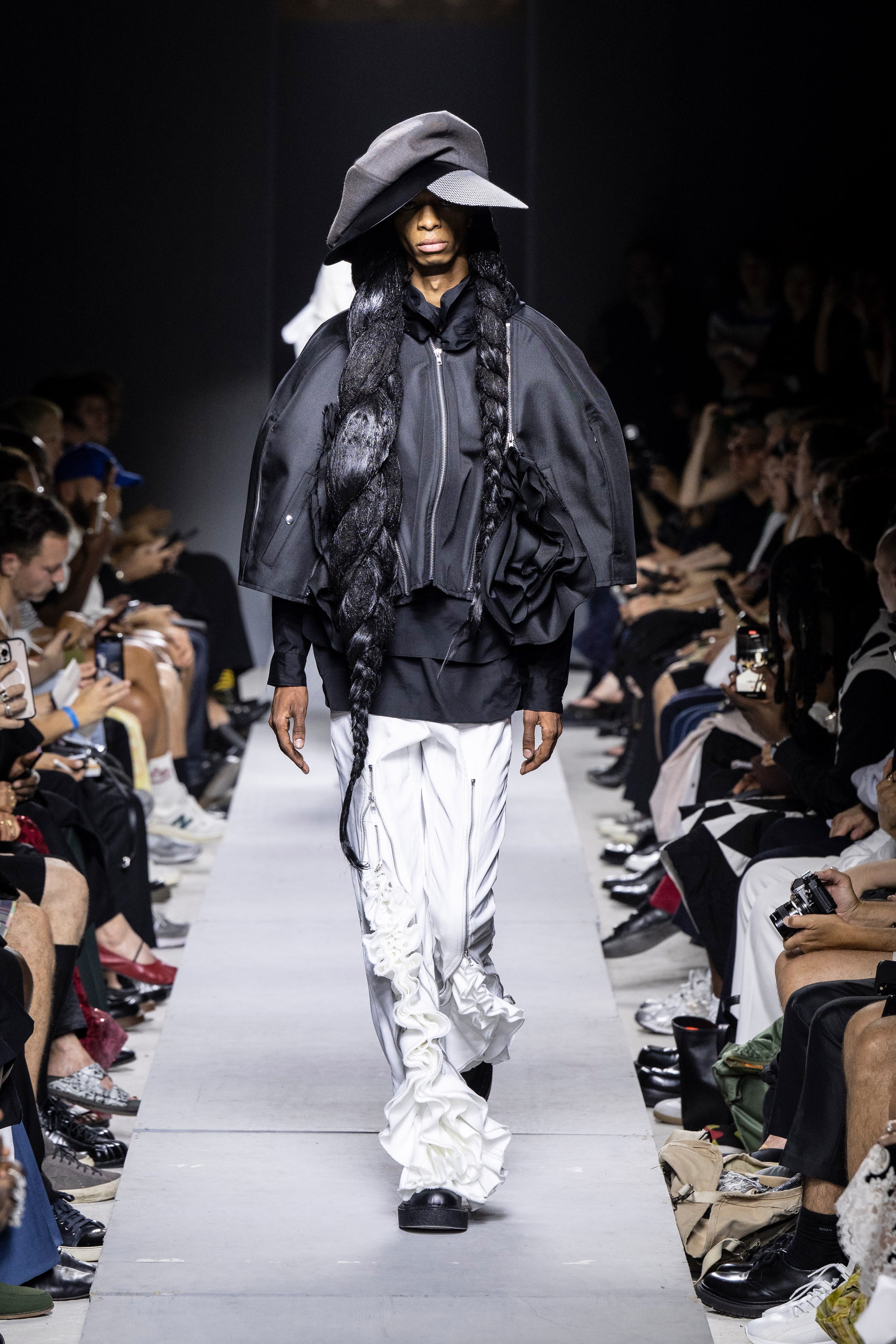 Fashion model wearing a Comme des Garçons Homme Plus SS26 outfit