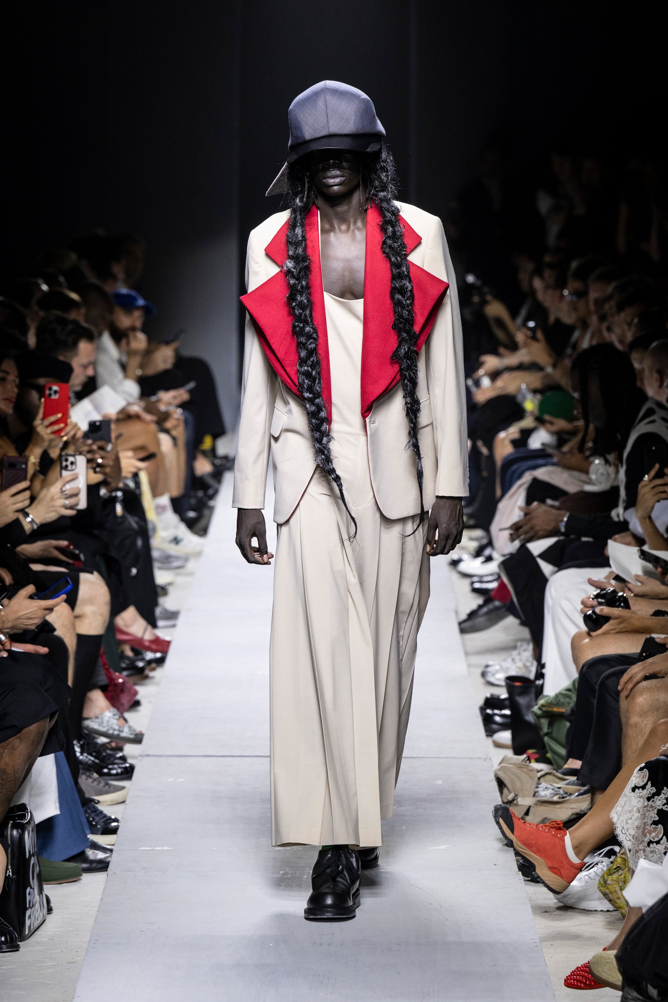 Fashion model wearing a Comme des Garçons Homme Plus SS26 outfit