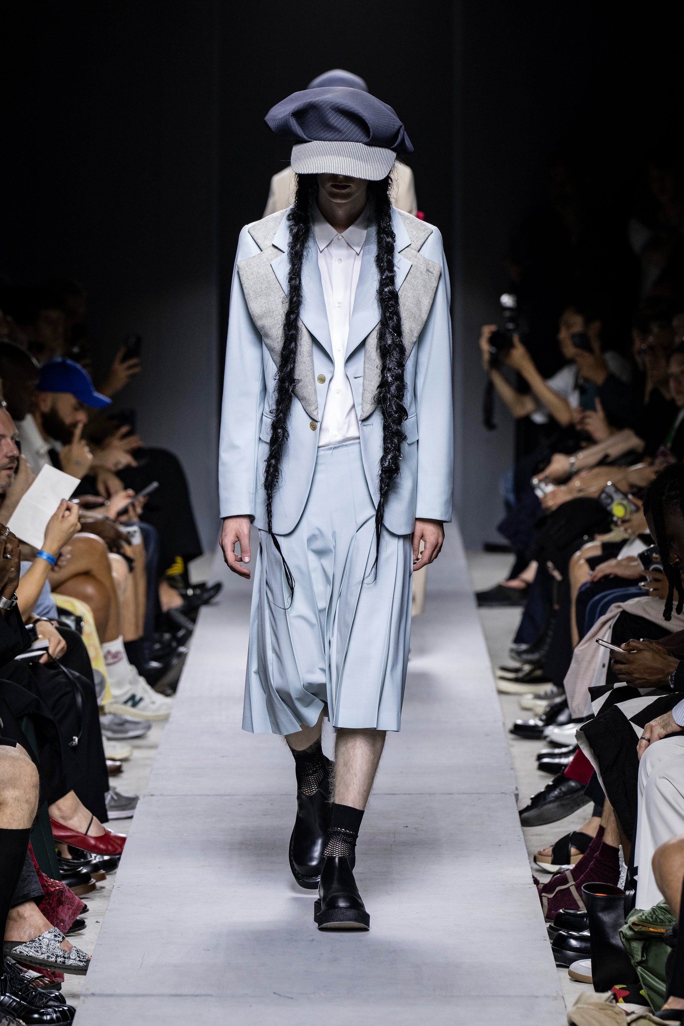 Fashion model wearing a Comme des Garçons Homme Plus SS26 outfit