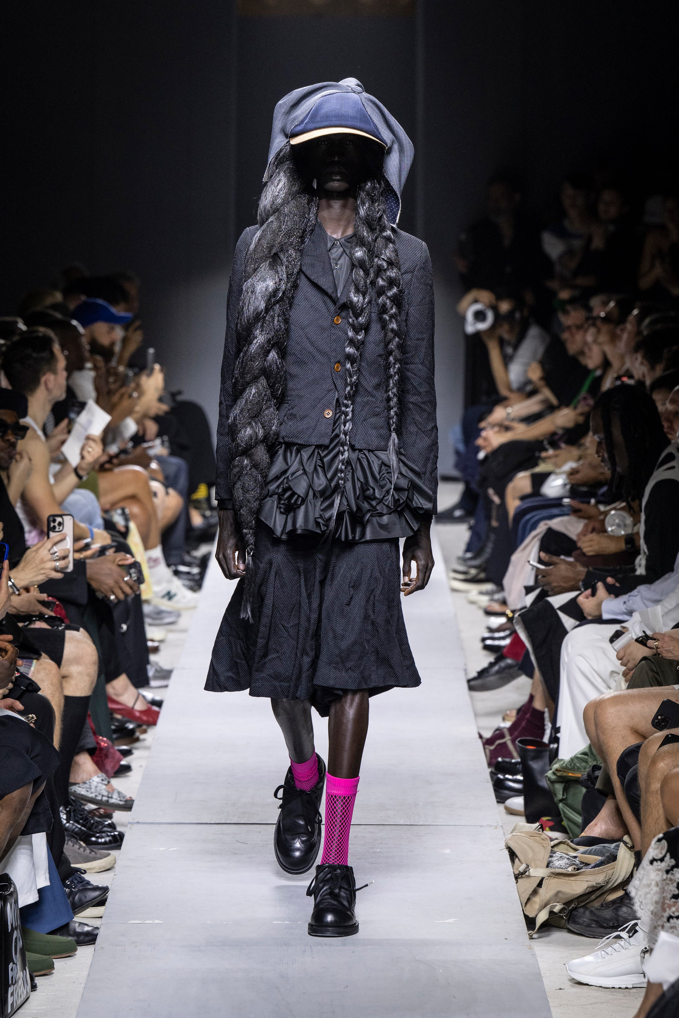 Fashion model wearing a Comme des Garçons Homme Plus SS26 outfit