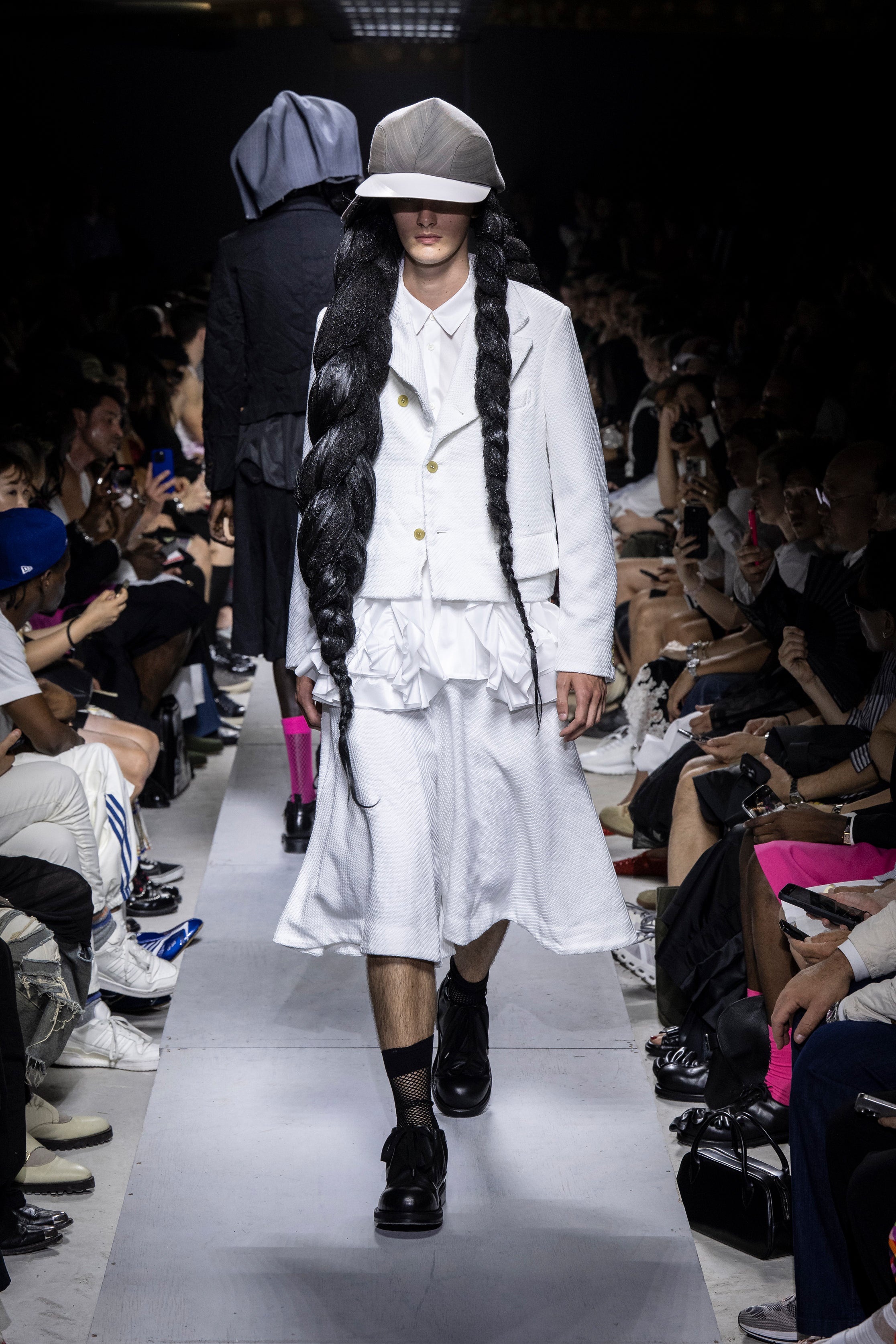 Fashion model wearing a Comme des Garçons Homme Plus SS26 outfit