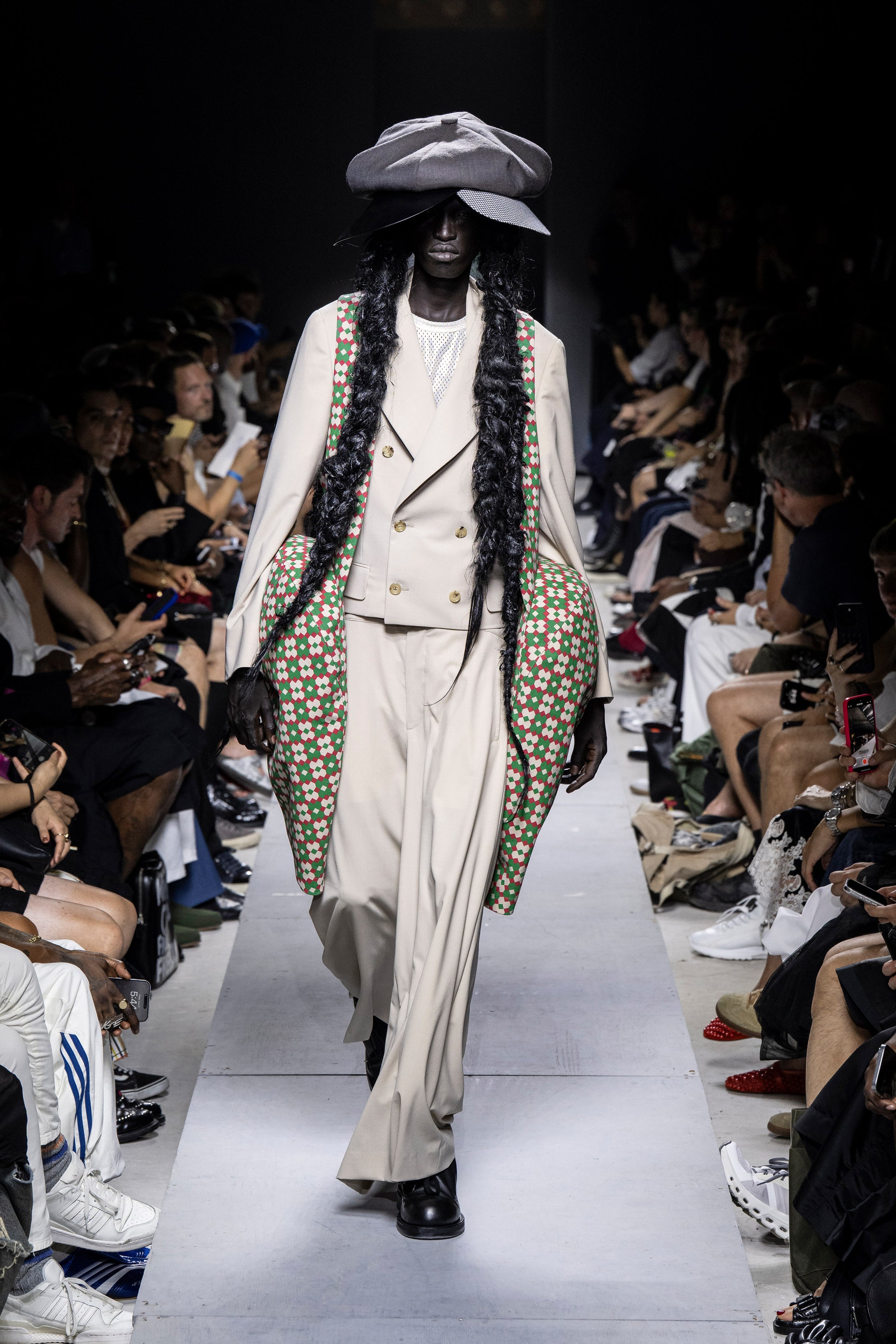 Fashion model wearing a Comme des Garçons Homme Plus SS26 outfit