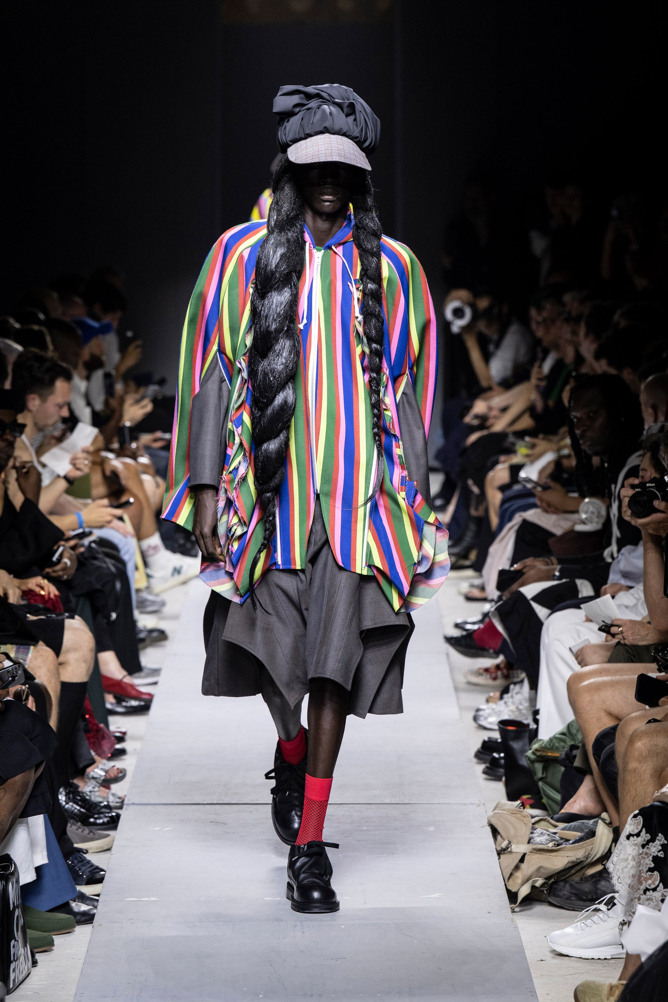 Fashion model wearing a Comme des Garçons Homme Plus SS26 outfit