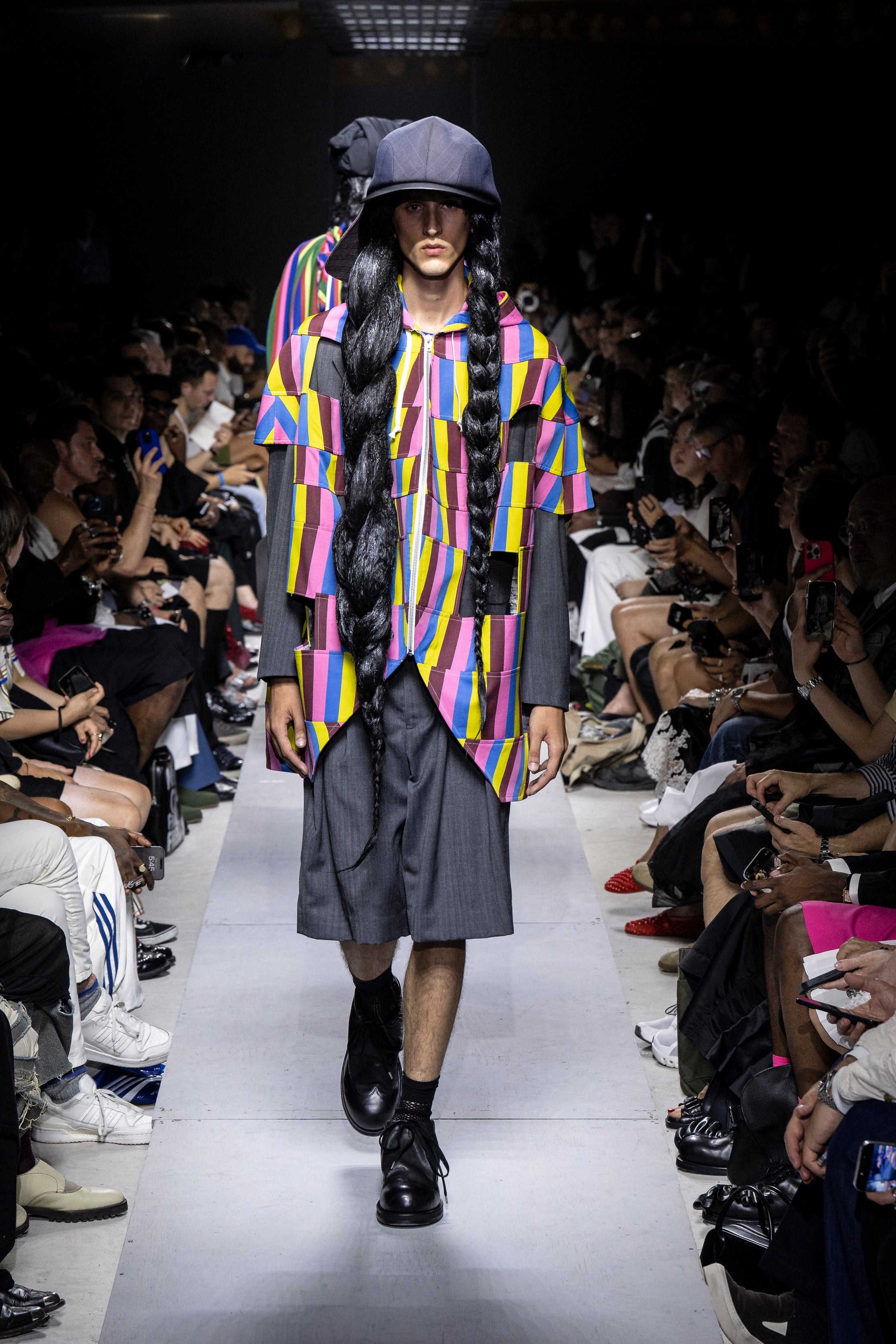 Fashion model wearing a Comme des Garçons Homme Plus SS26 outfit