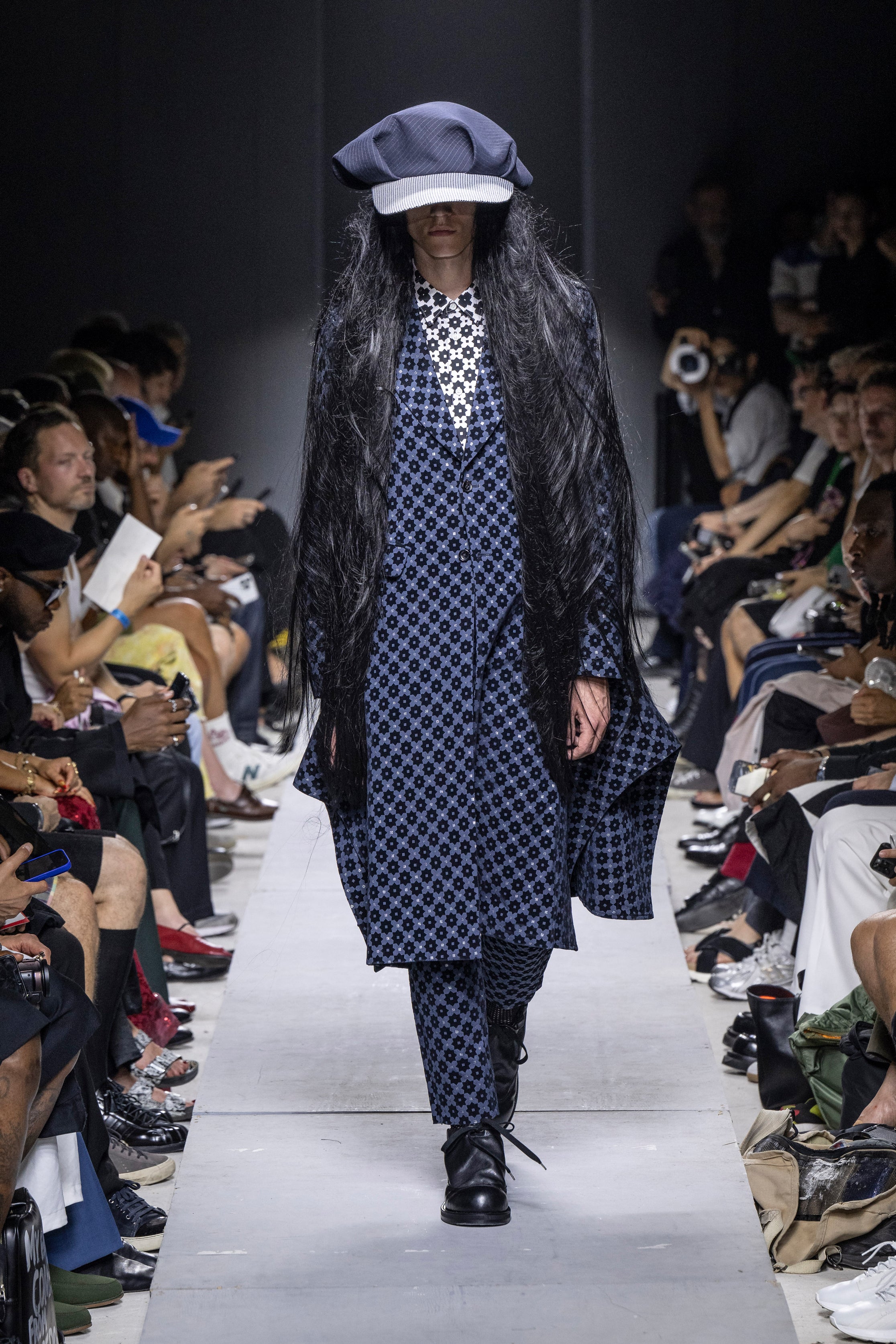 Fashion model wearing a Comme des Garçons Homme Plus SS26 outfit