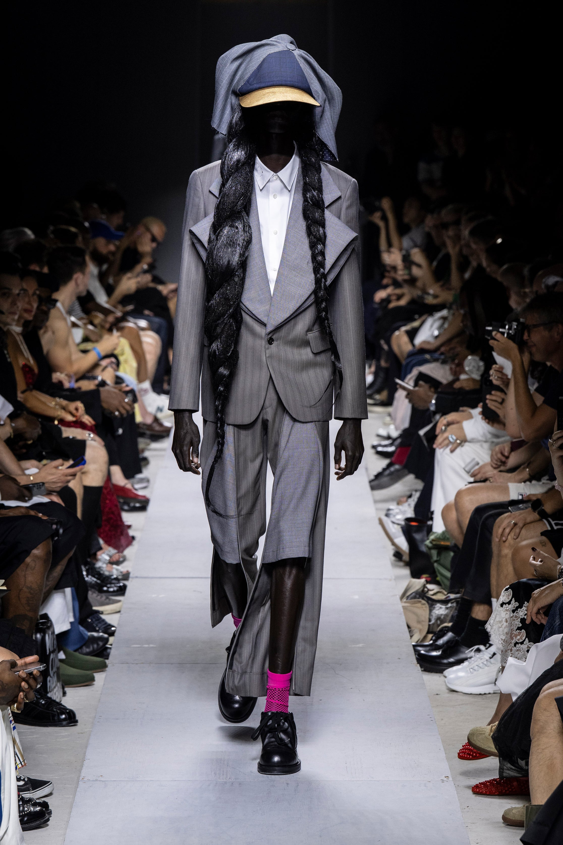 Fashion model wearing a Comme des Garçons Homme Plus SS26 outfit