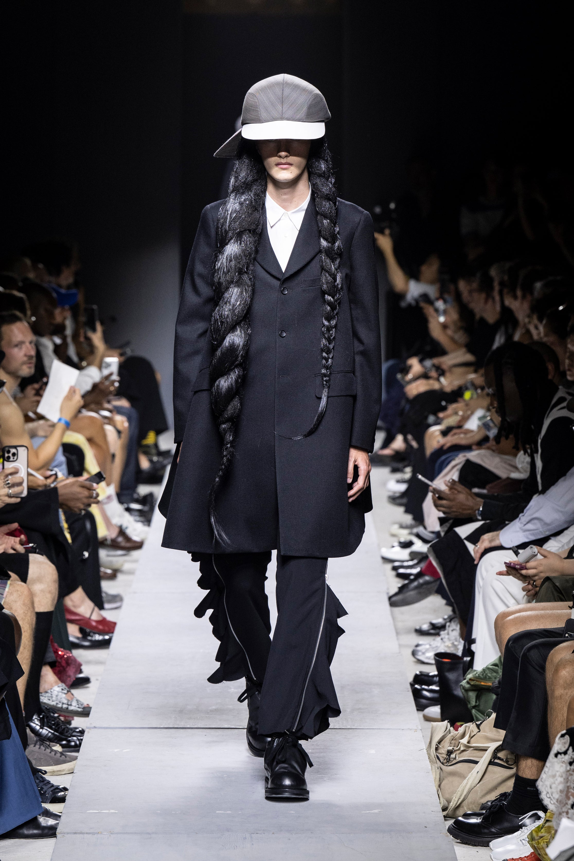 Fashion model wearing a Comme des Garçons Homme Plus SS26 outfit