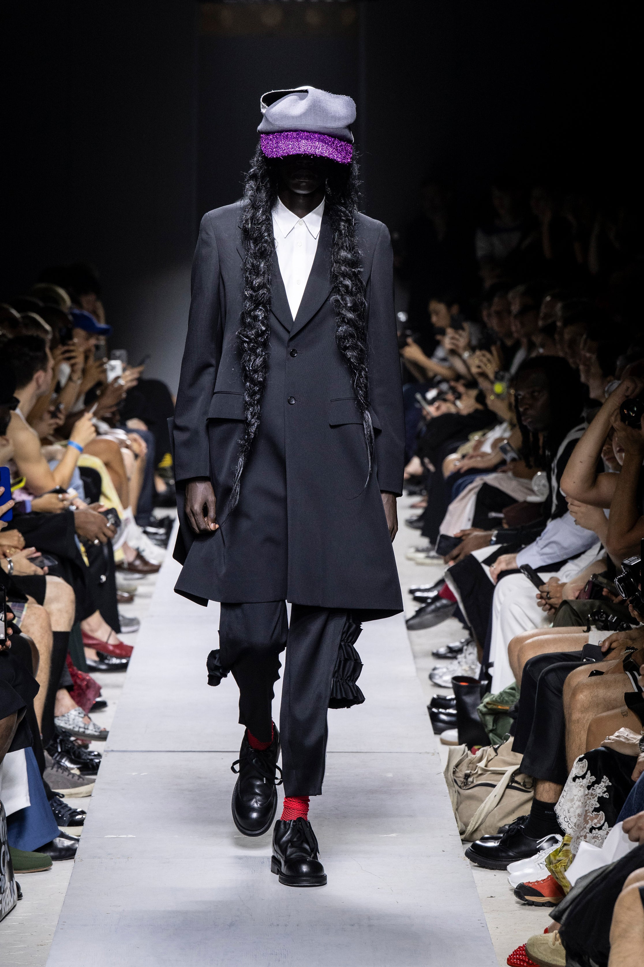 Fashion model wearing a Comme des Garçons Homme Plus SS26 outfit