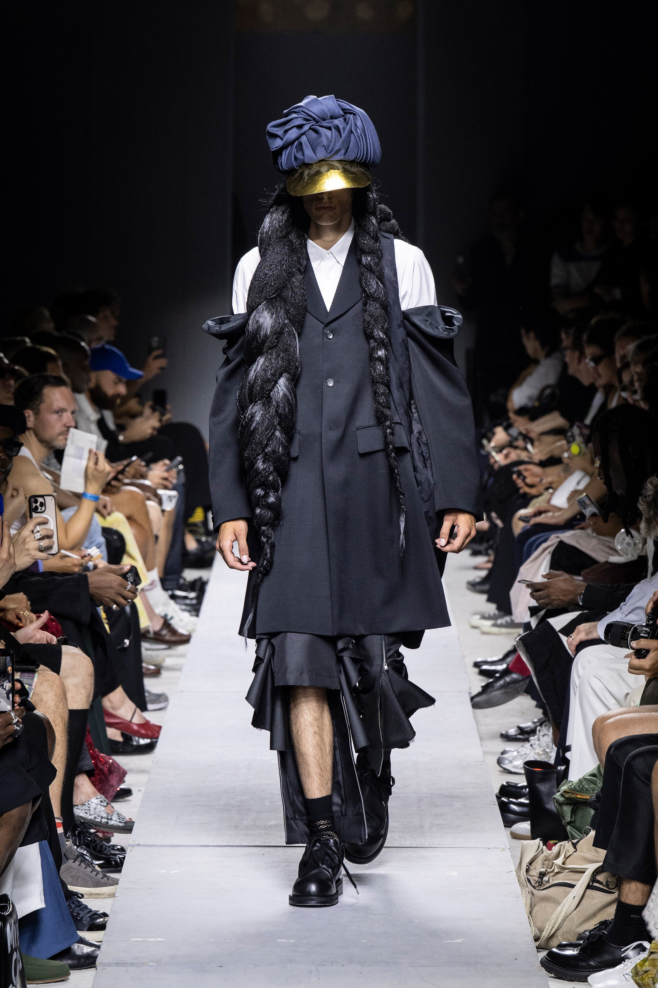 Fashion model wearing a Comme des Garçons Homme Plus SS26 outfit