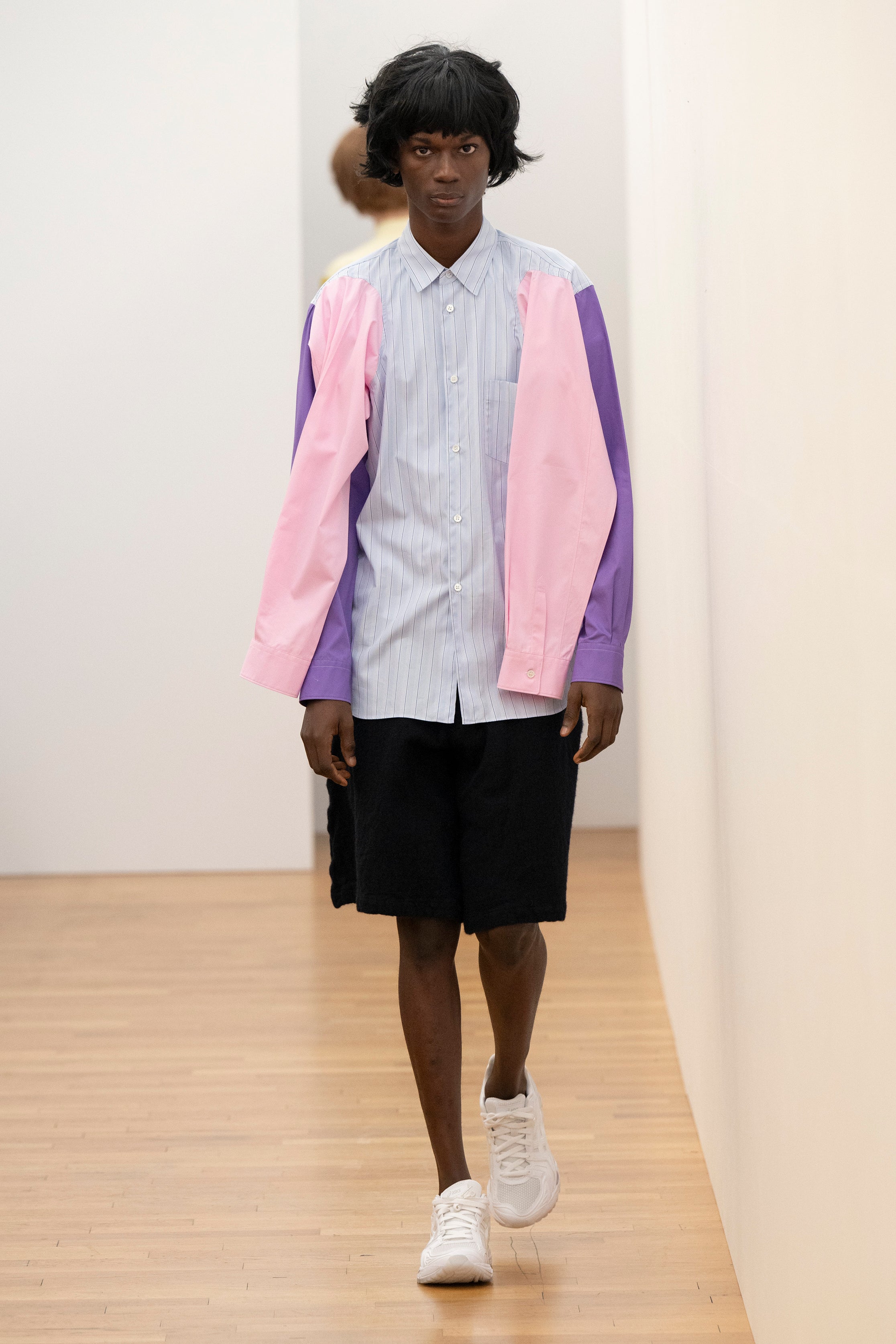 Fashion model wearing a Comme des Garçons Shirt AW25 outfit