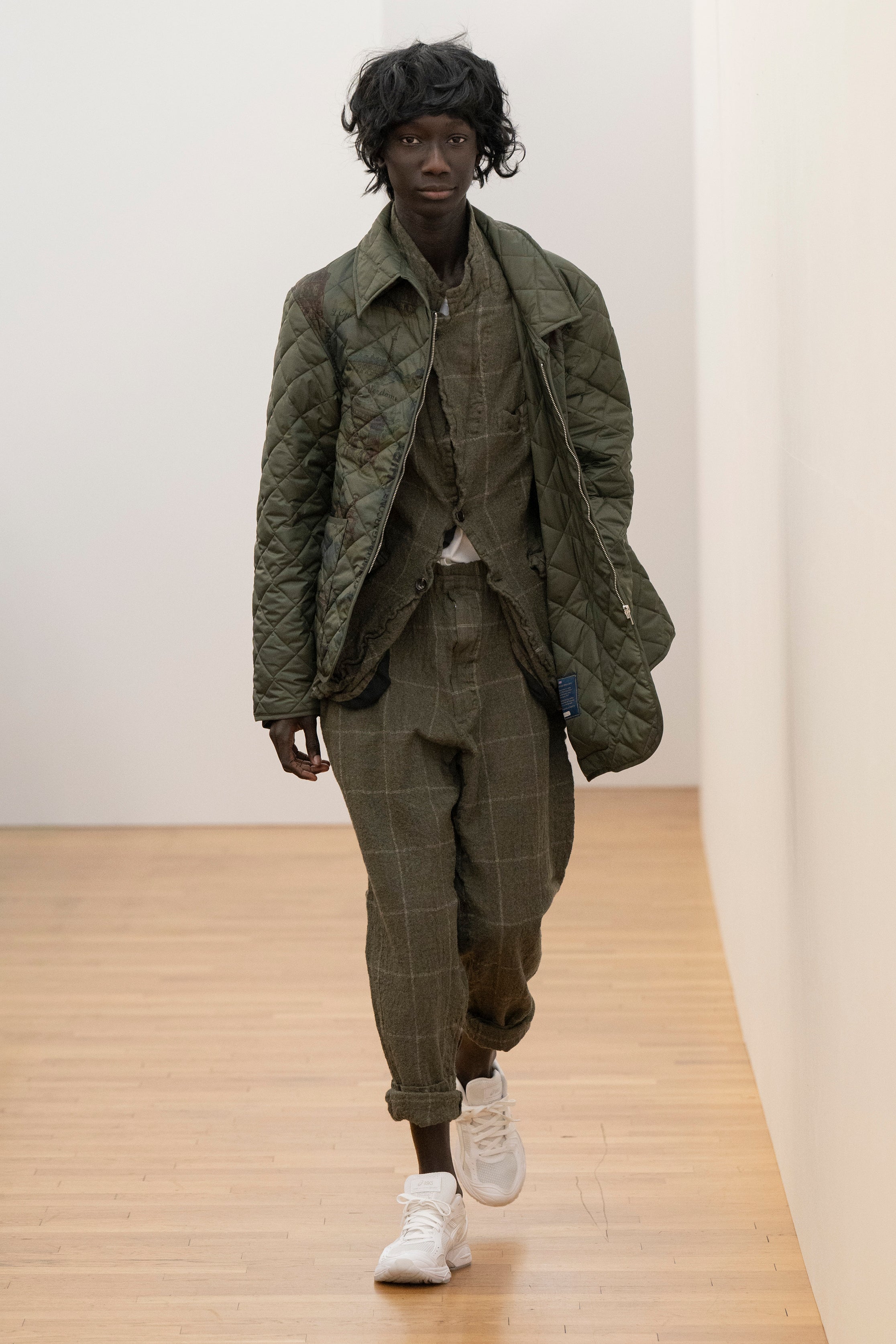 Fashion model wearing a Comme des Garçons Shirt AW25 outfit