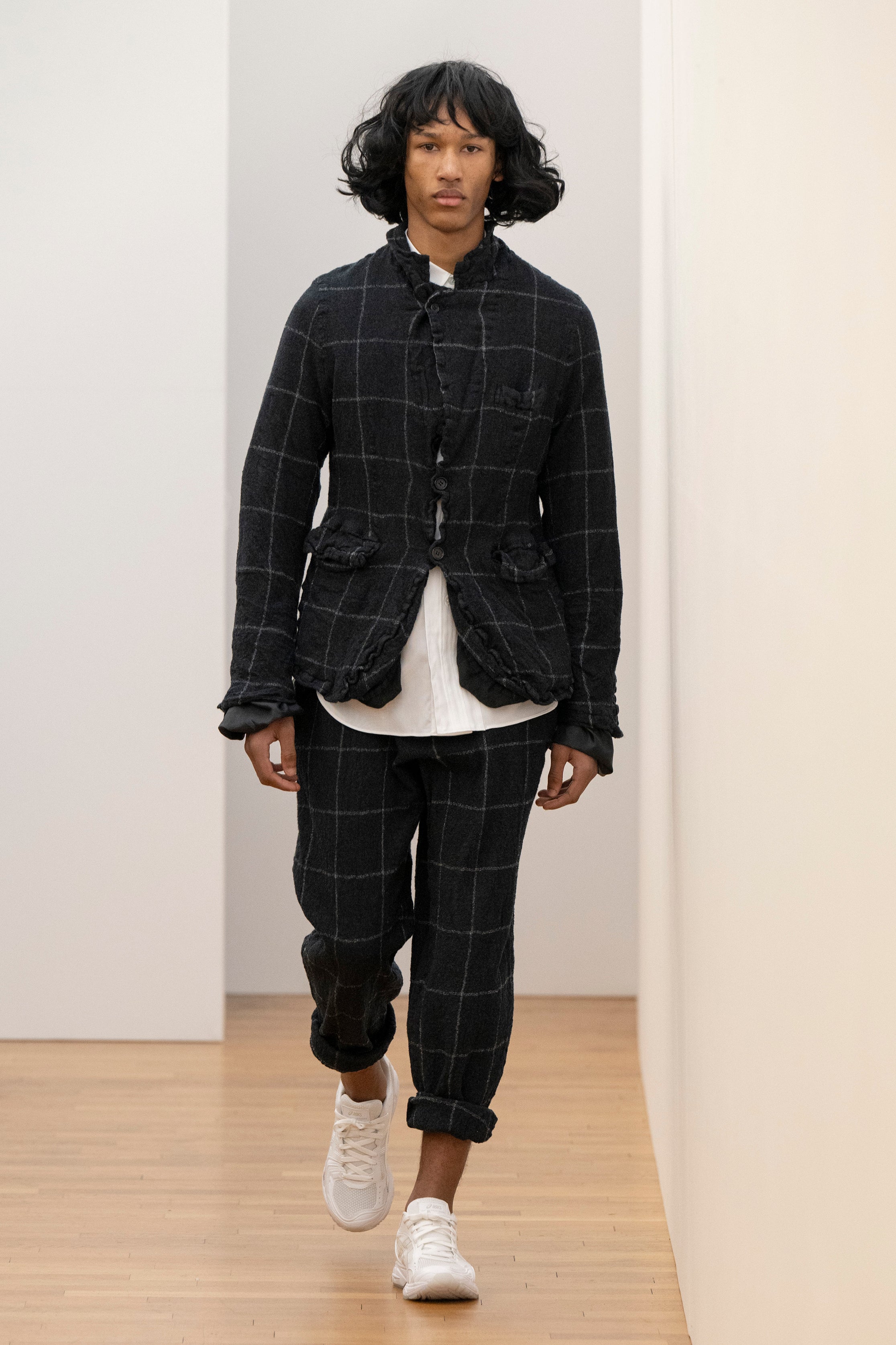Fashion model wearing a Comme des Garçons Shirt AW25 outfit