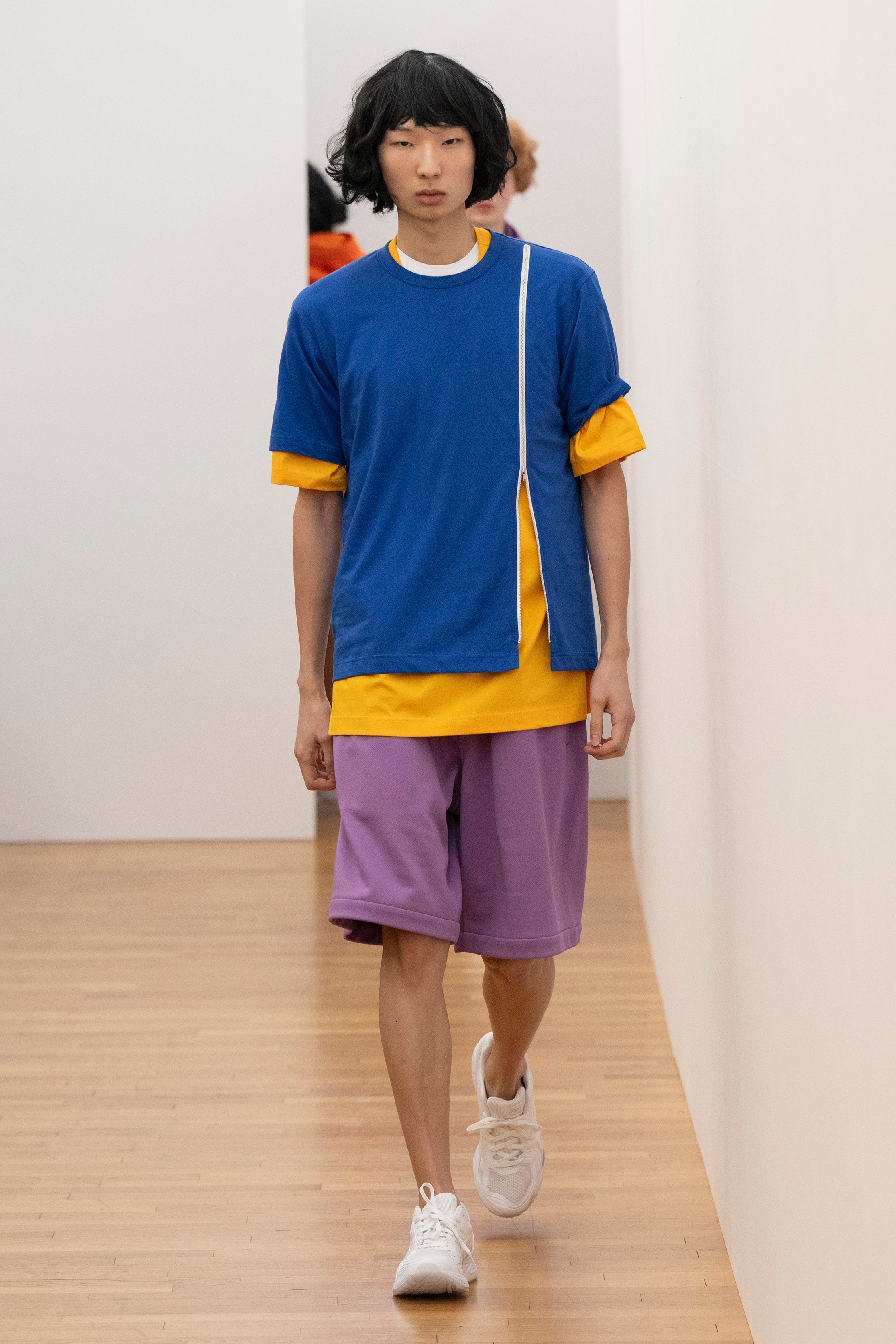Fashion model wearing a Comme des Garçons Shirt AW25 outfit