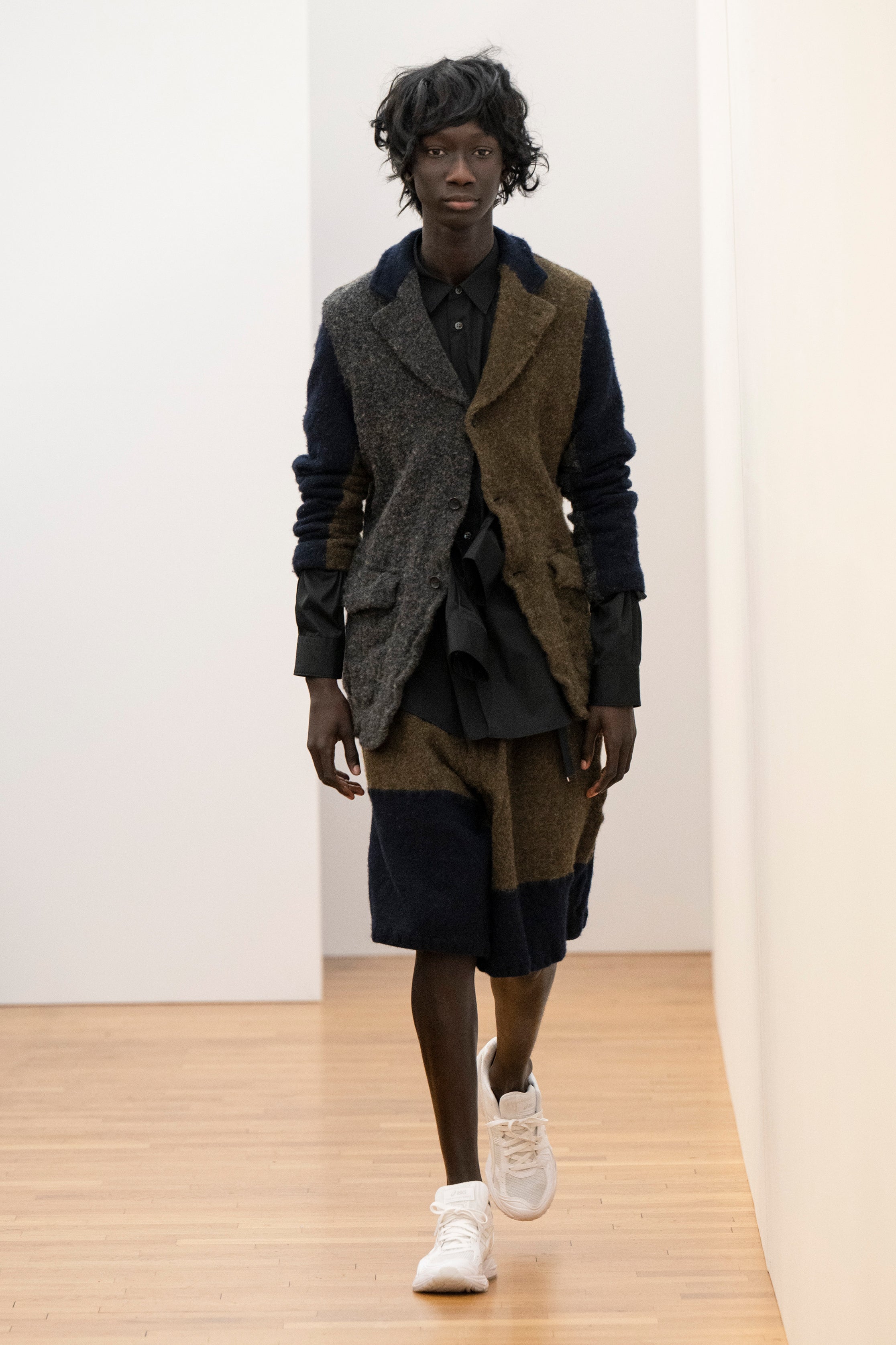 Fashion model wearing a Comme des Garçons Shirt AW25 outfit