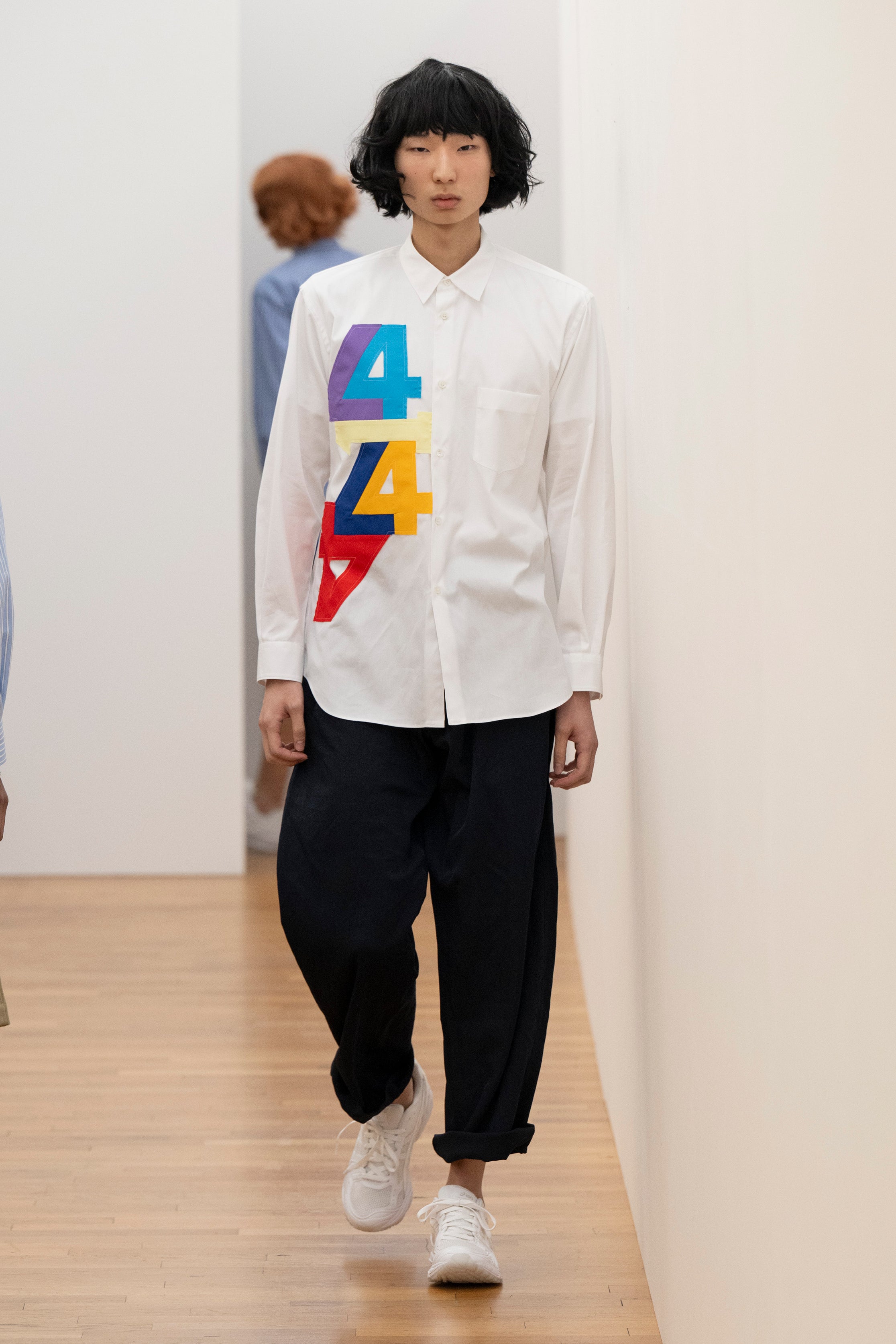Fashion model wearing a Comme des Garçons Shirt AW25 outfit